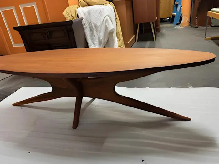 Vintage mid-century modern solid walnut coffee table with sculptural look.