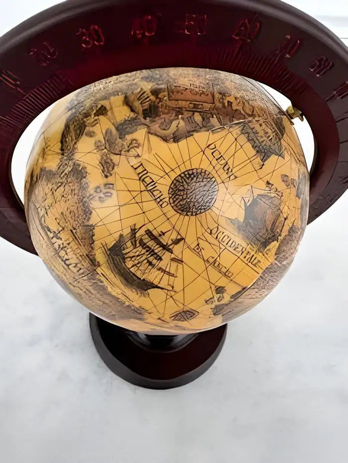 Antique wooden base stand terrestrial globe with intricate map design.