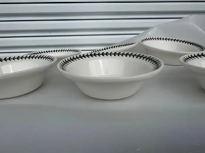 Lot of six collectible Portmeirion plates with oatmeal design.