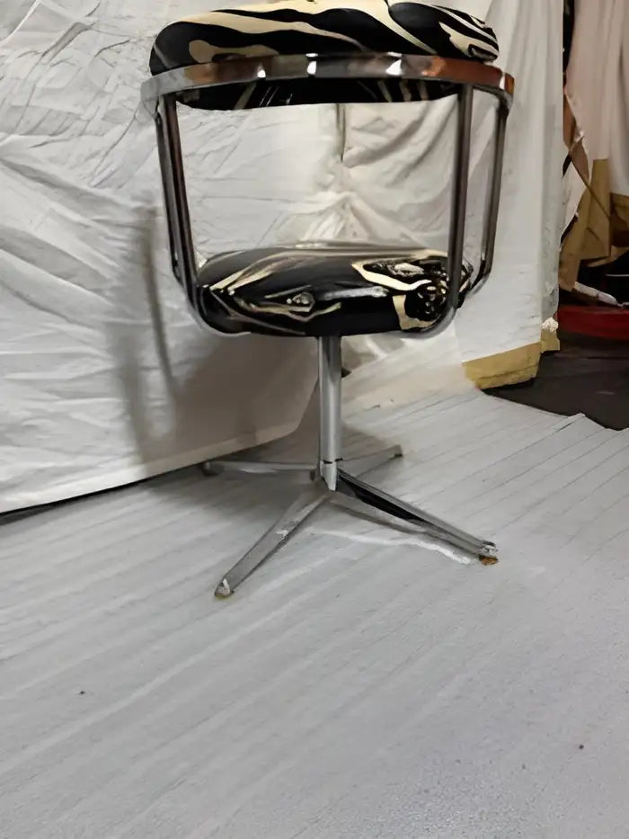 Classic vintage chrome swivel chair, ideal for office or home decor.