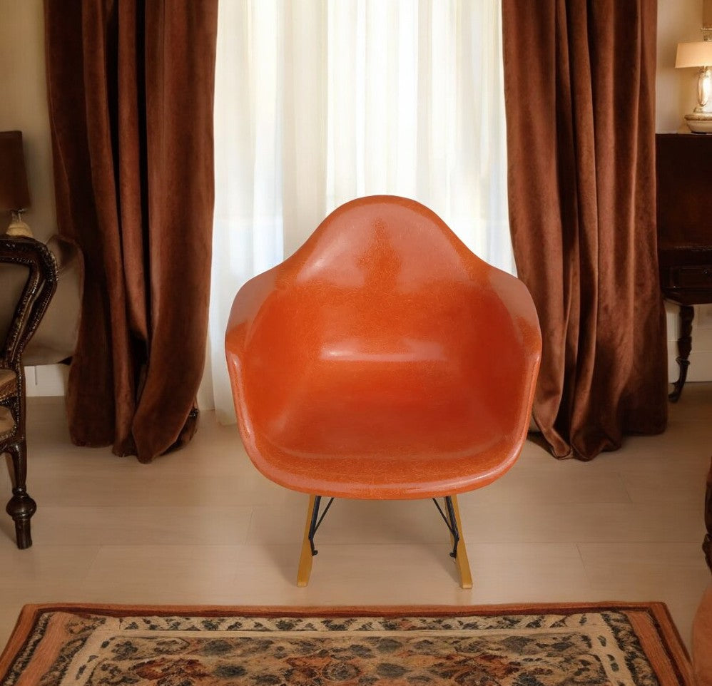 Herman Miller Eames RAR rocker with orange shell