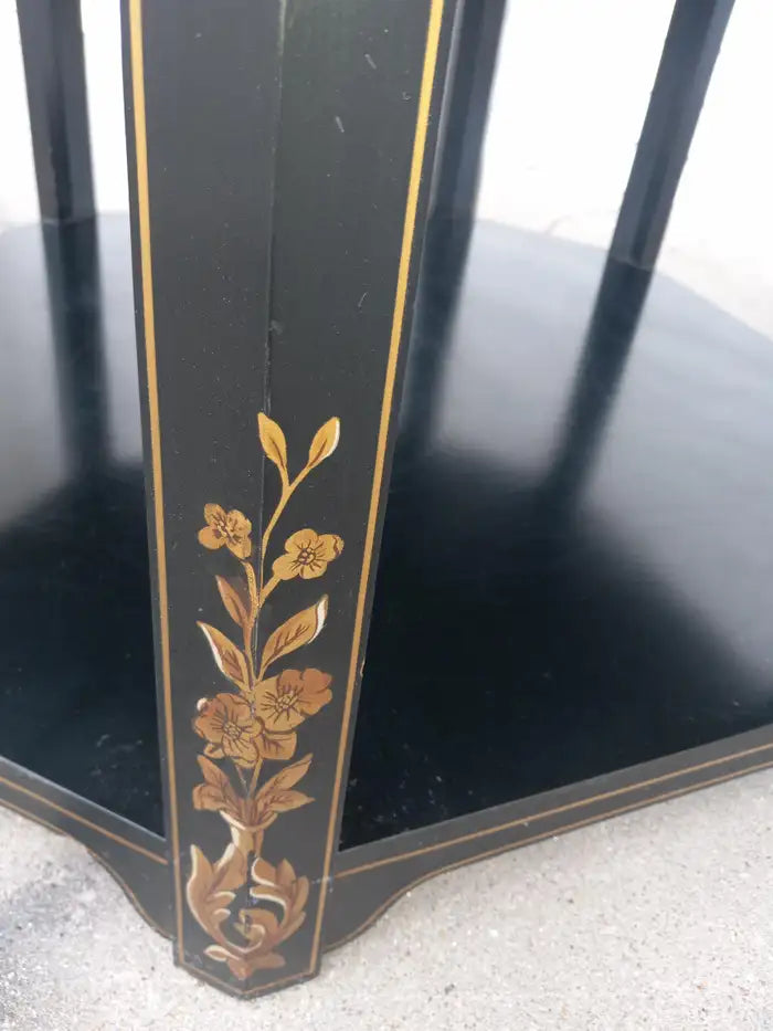 Asian-inspired lacquered accent table with three tiers and Chinoiserie style.