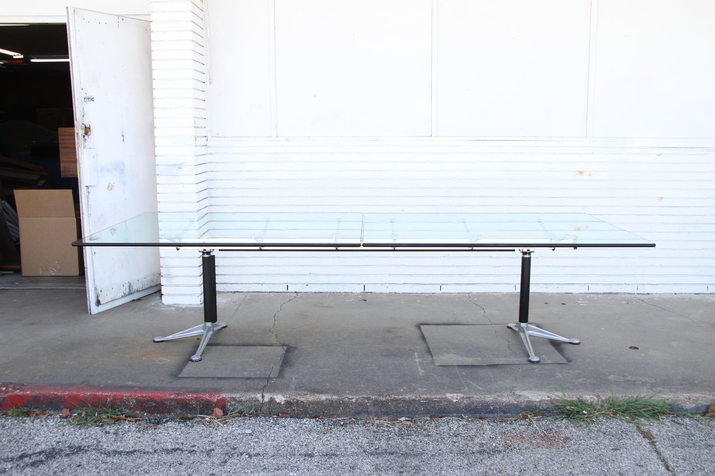 Glass top Burdick table with aluminum base