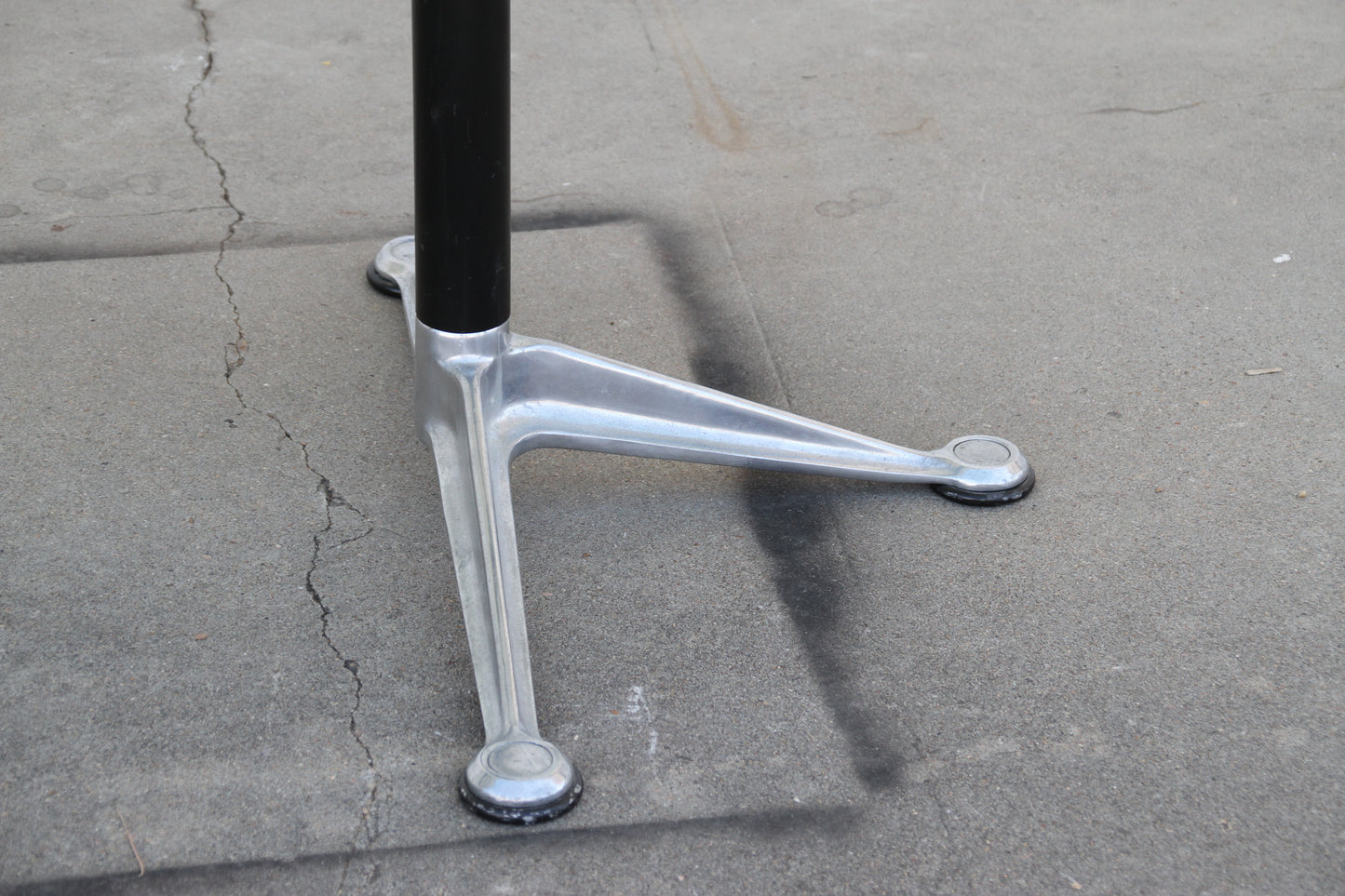 Close-up of Burdick table legs and glass