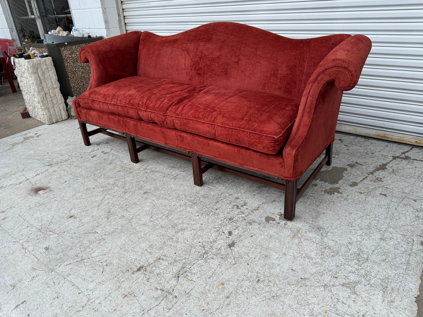 Luxury vintage sofa in deep red upholstery, perfect for classic or modern heritage interiors