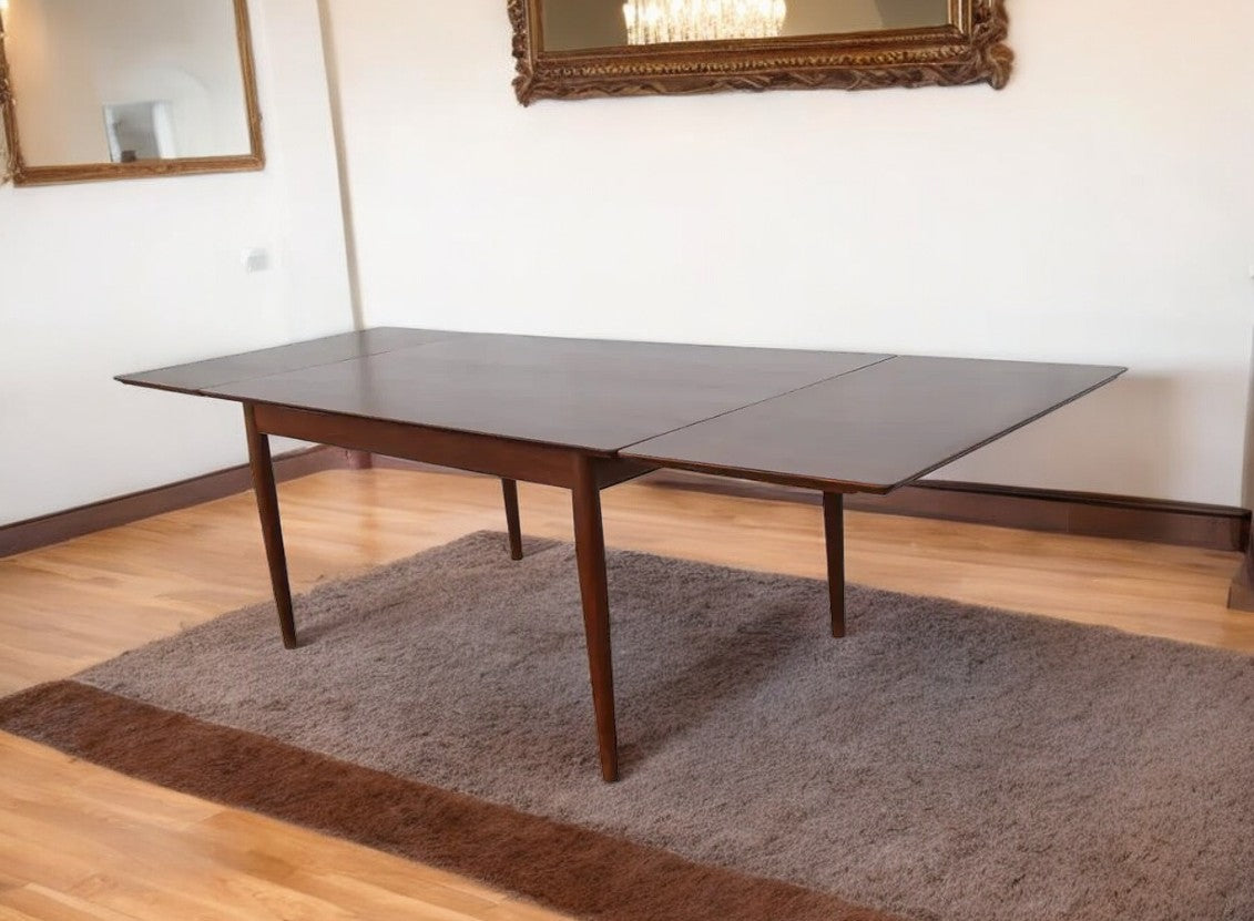 Teak extendable dining table with clean lines