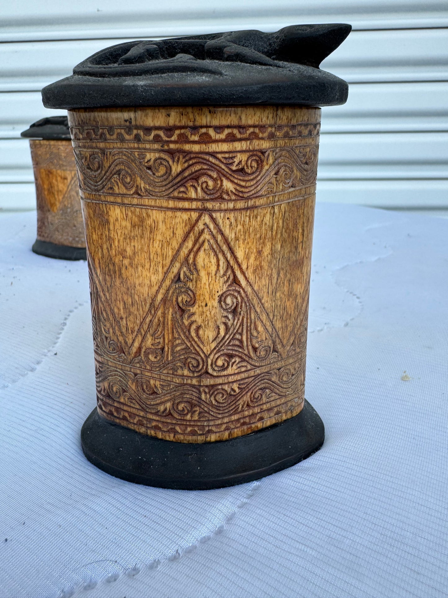 Antique style bone storage containers with artisan craftsmanship and pattern details
