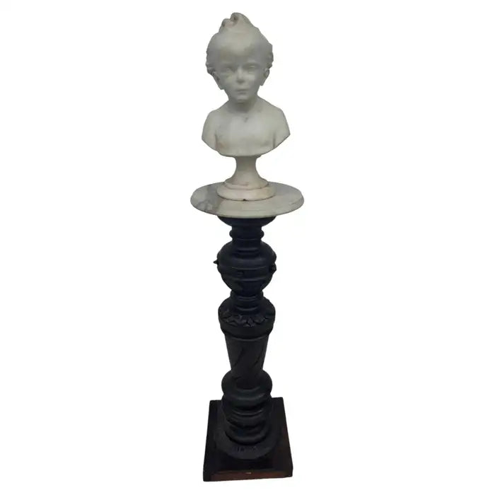 White marble boy sculpture with natural veining