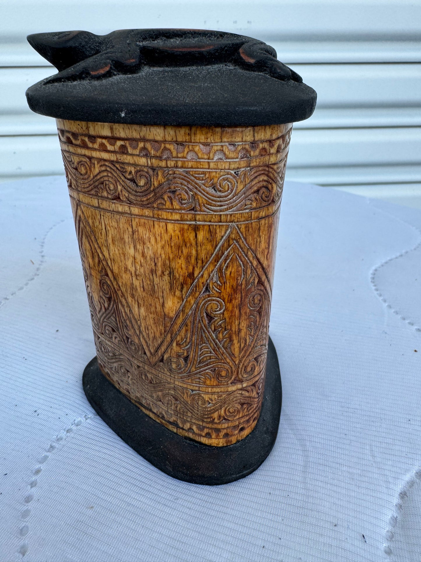 Artistic carved bone box with cultural patterns and smooth matte lid