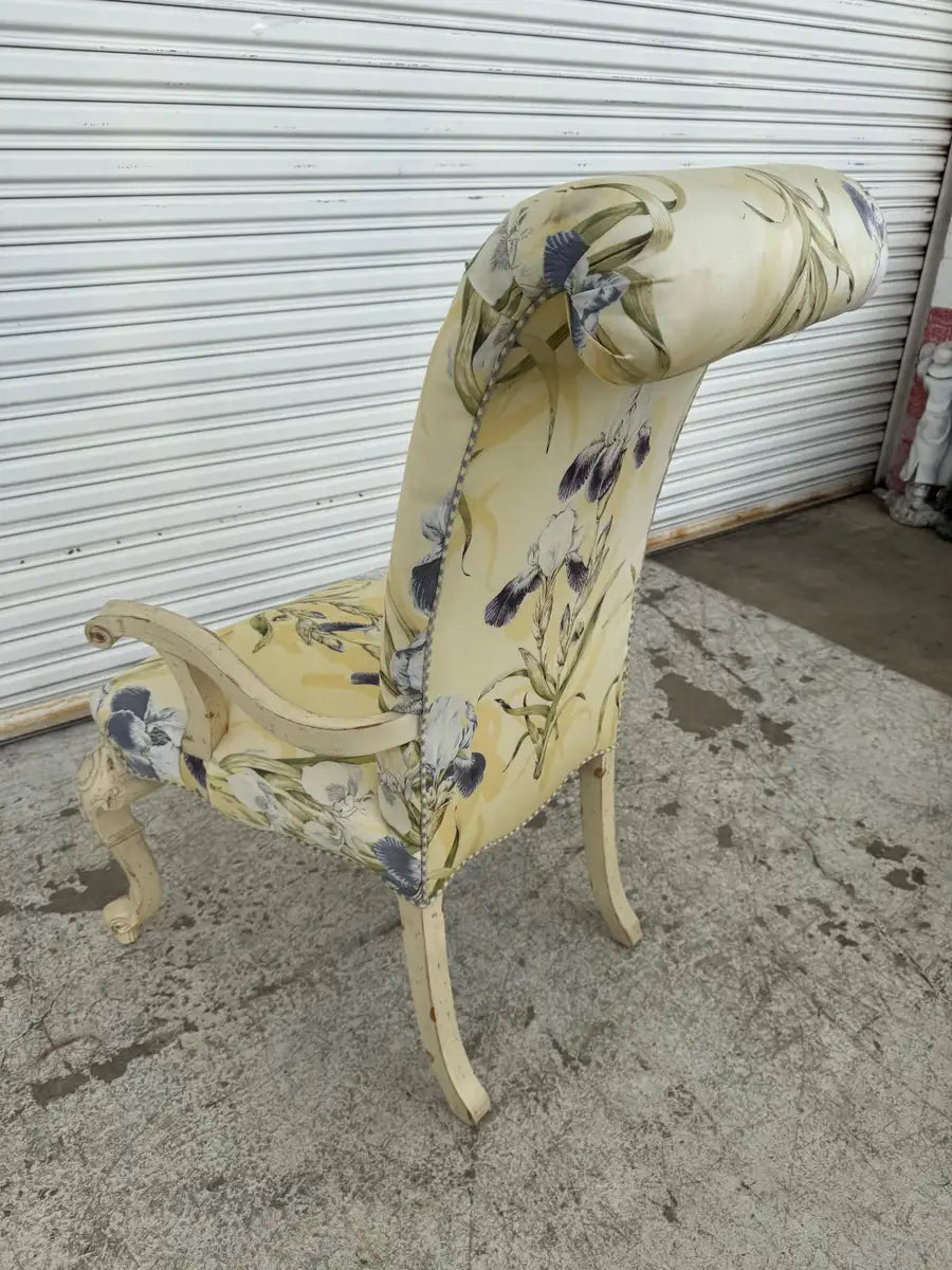 Hand-carved wooden armchair with upholstered backrest and seat