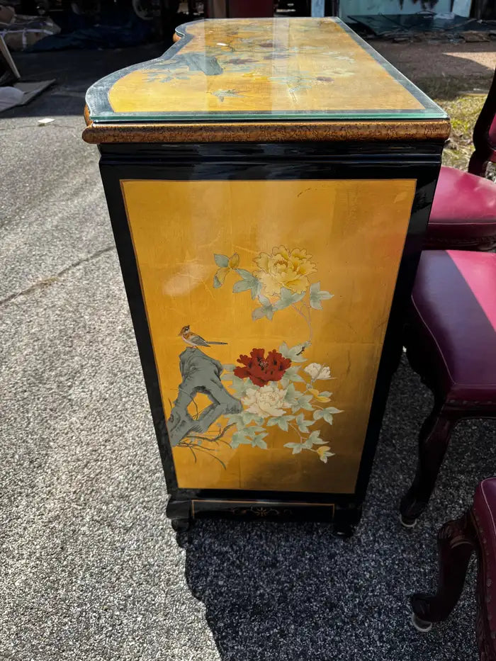 Chinoiserie style cabinet intricate painted gold motifs black base