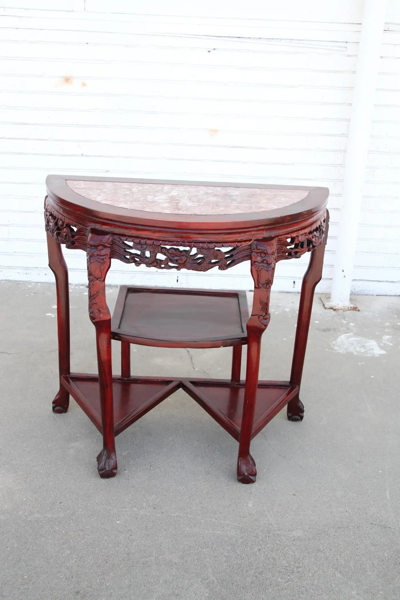 Marble top demilune console with intricate carvings