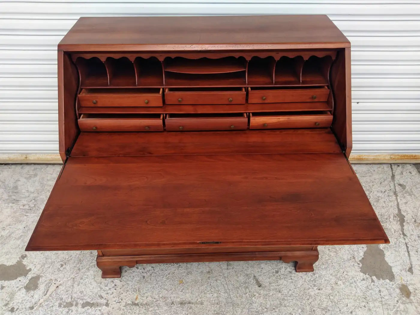 Close-up of Wildwood cherry secretary with drawers