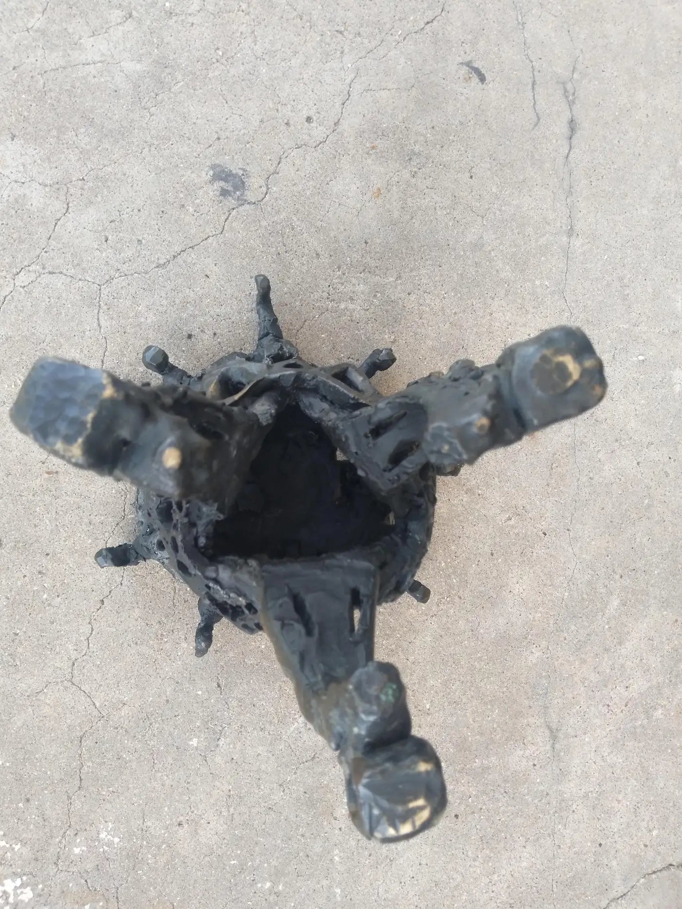 Industrial-style bronze brutalist artwork