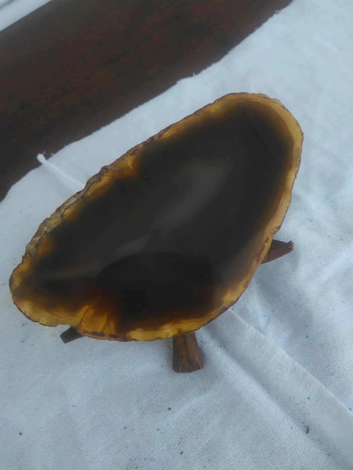 Stunning brown agate geode art piece on wood
