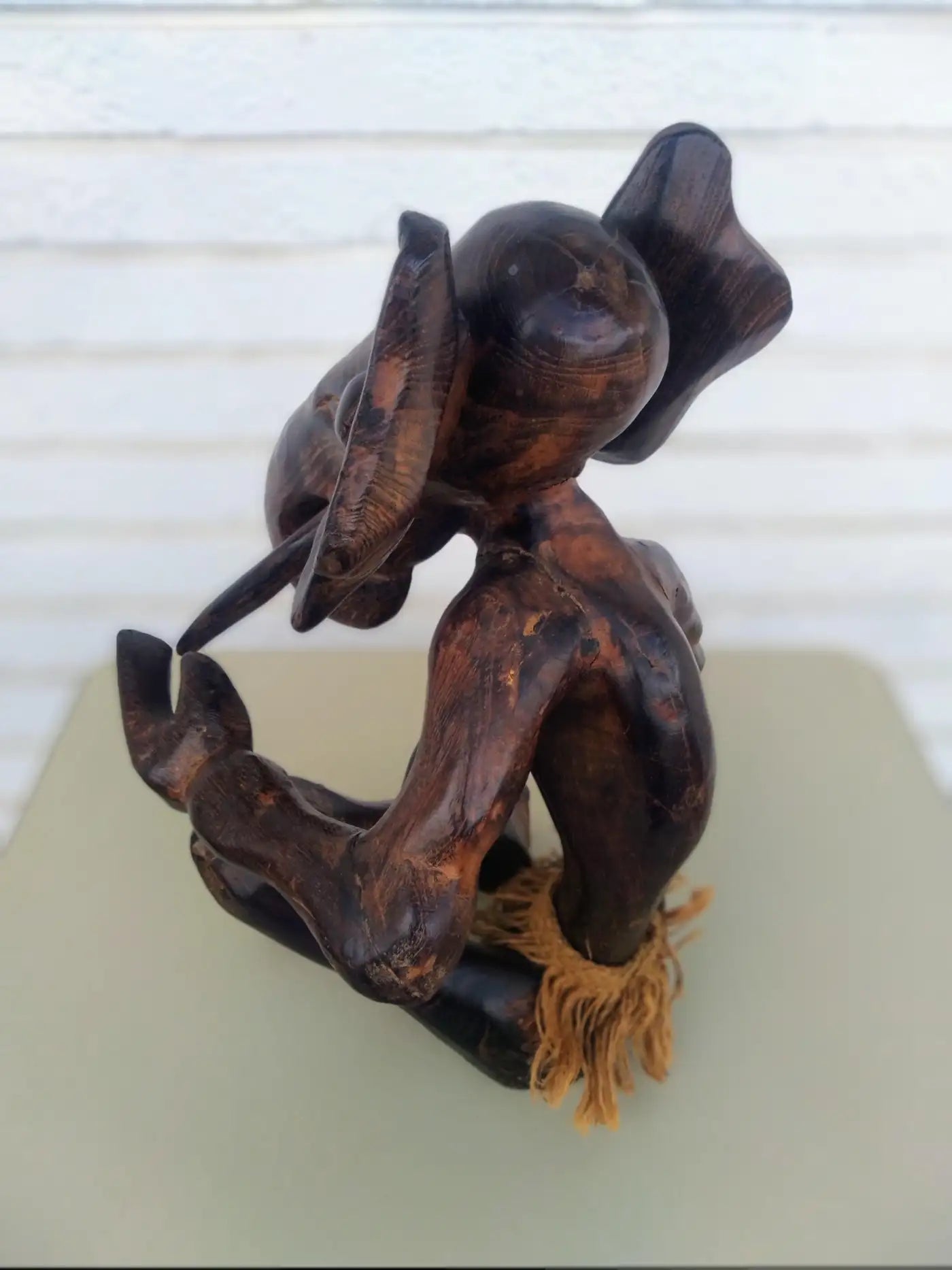 Artisan hand-carved elephant wood sculpture with intricate design