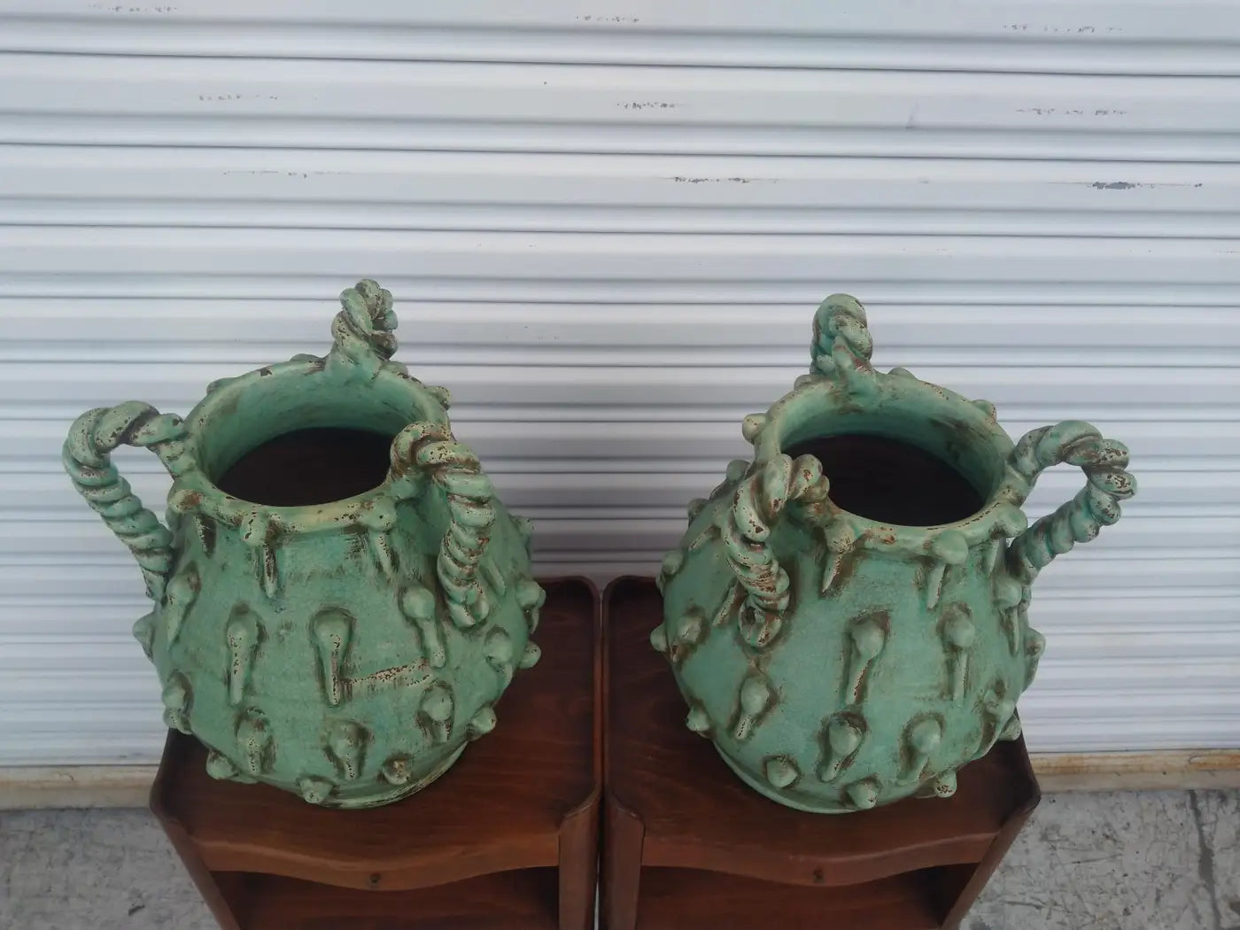 Pair of lime green sculptural vases with unique design