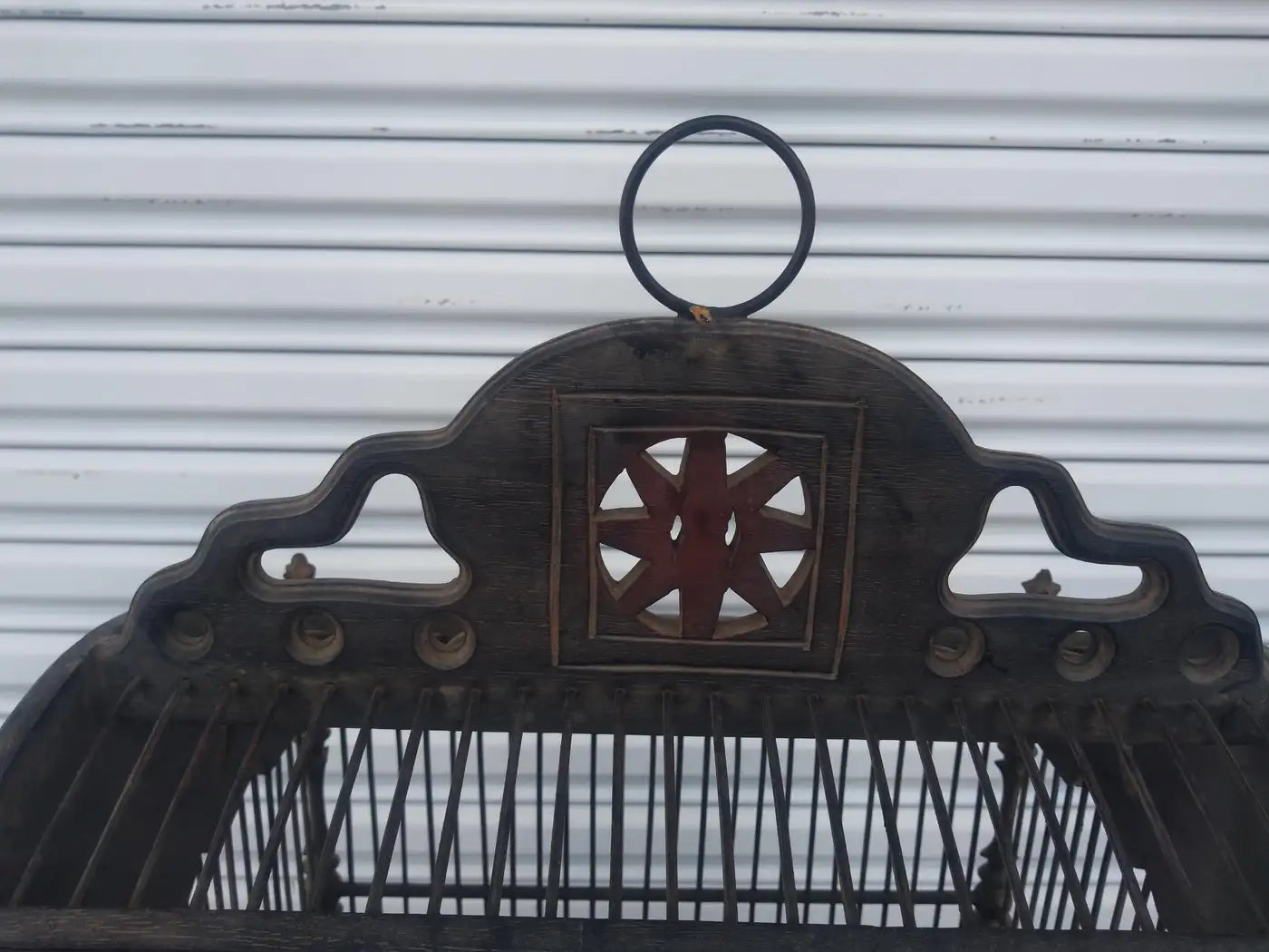 Decorative vintage metal bird cage with intricate details