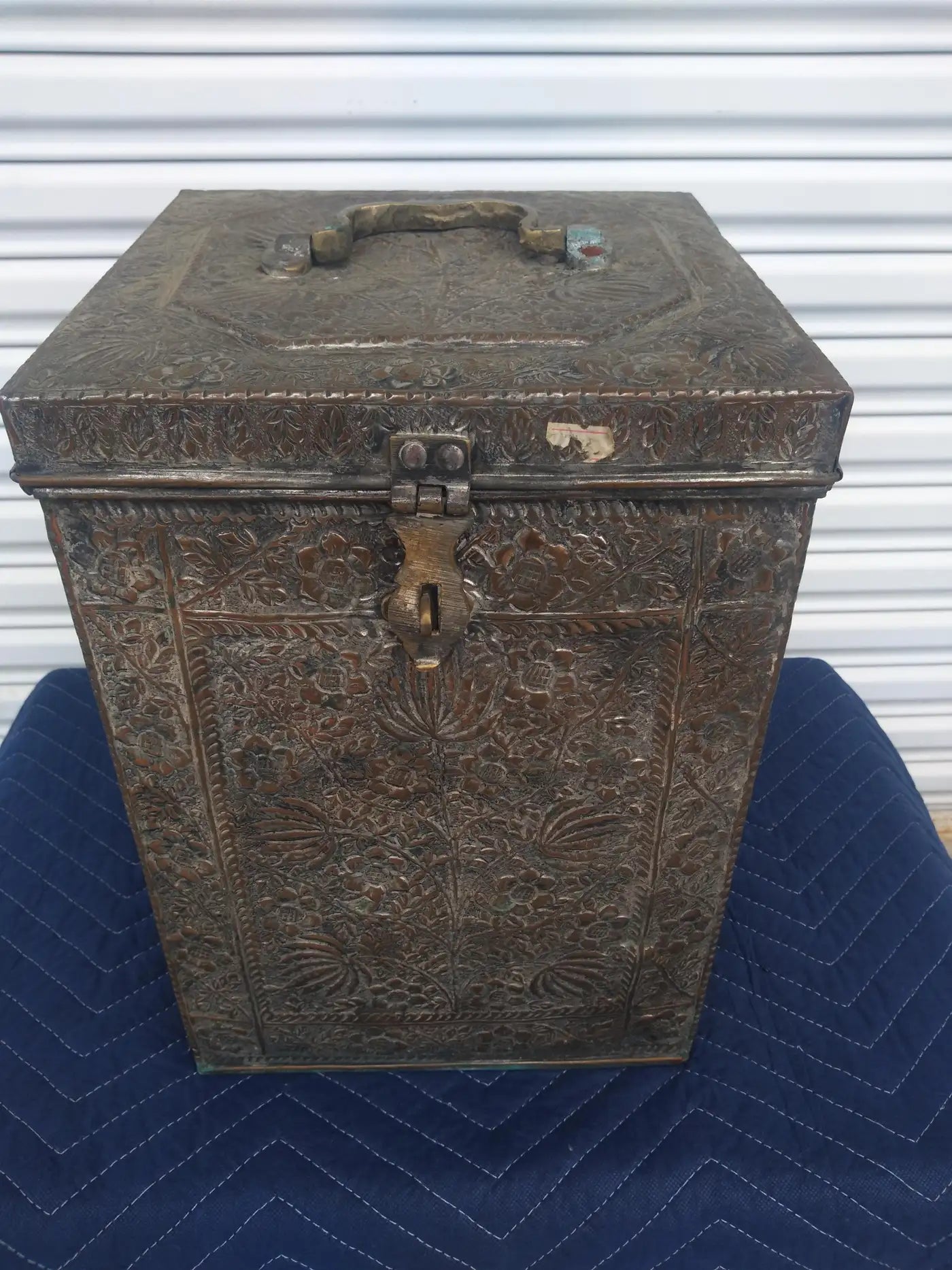Ornate copper chest with Islamic pattern design