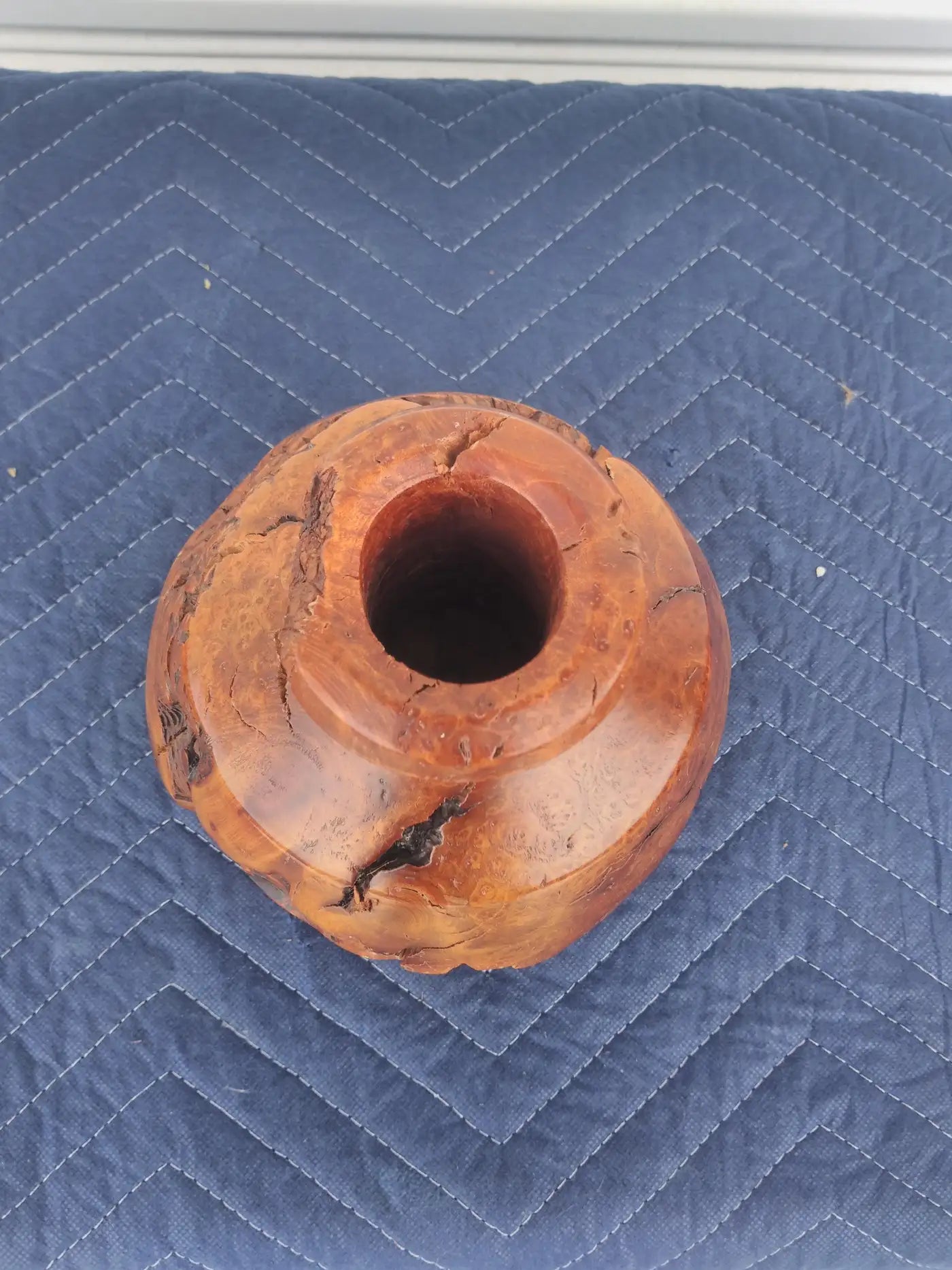 Artisan wood sculpture with smooth organic form