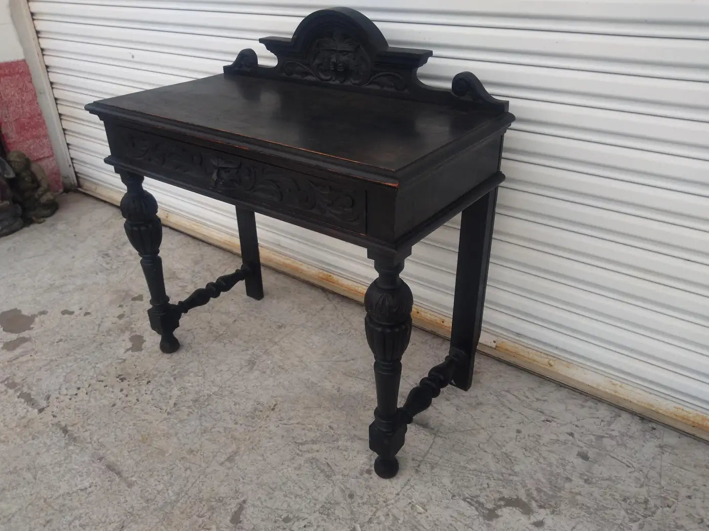 Ornate antique writing desk with lion head details
