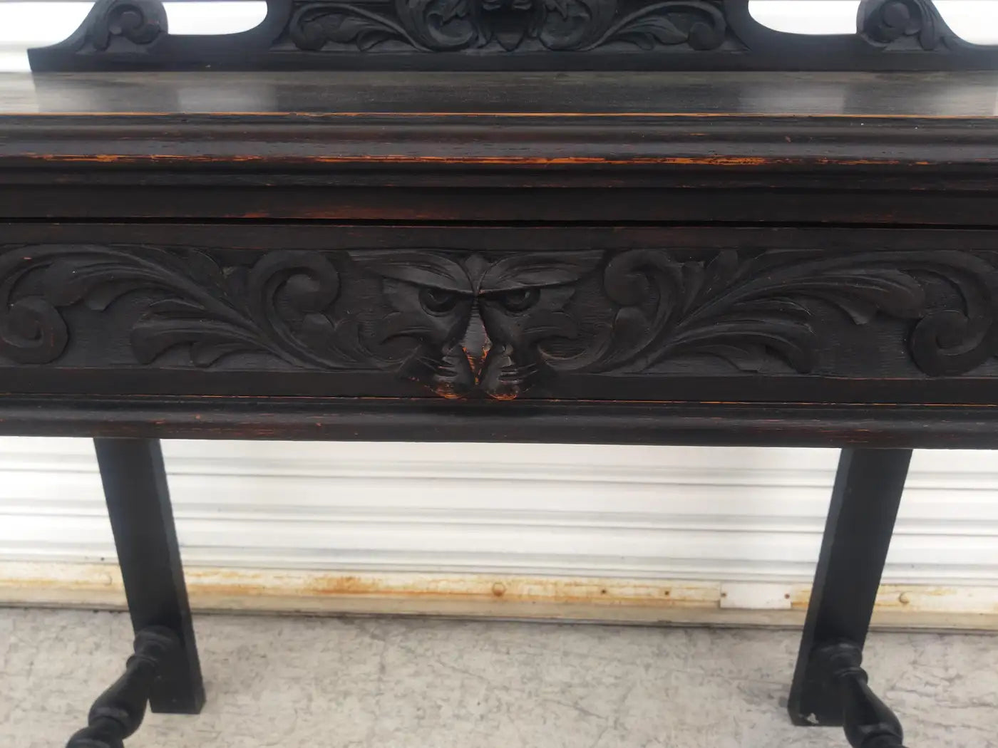 Tudor-style desk with detailed wood carvings