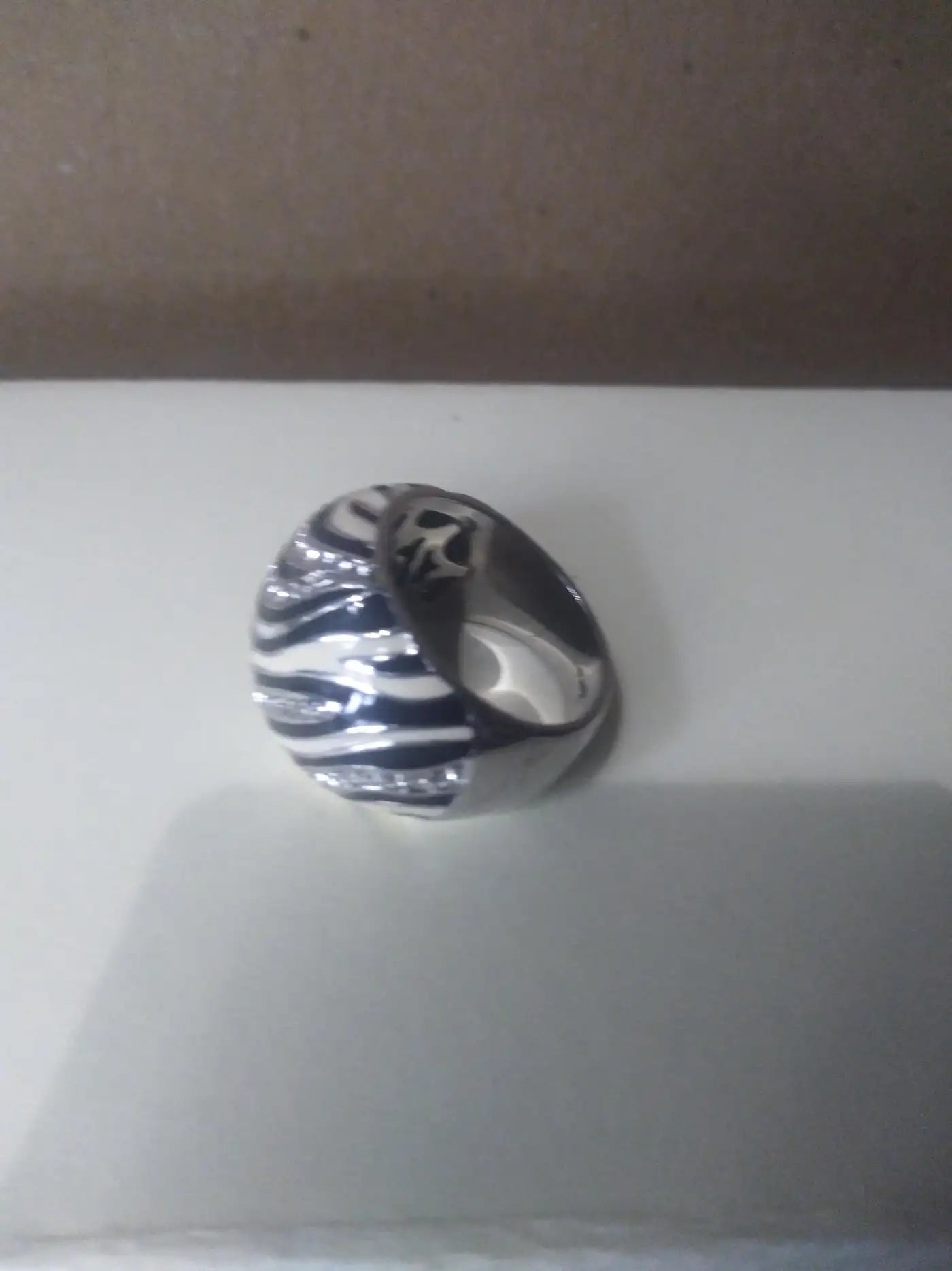 Stylish tiger striped sterling silver ring with cubic zirconia