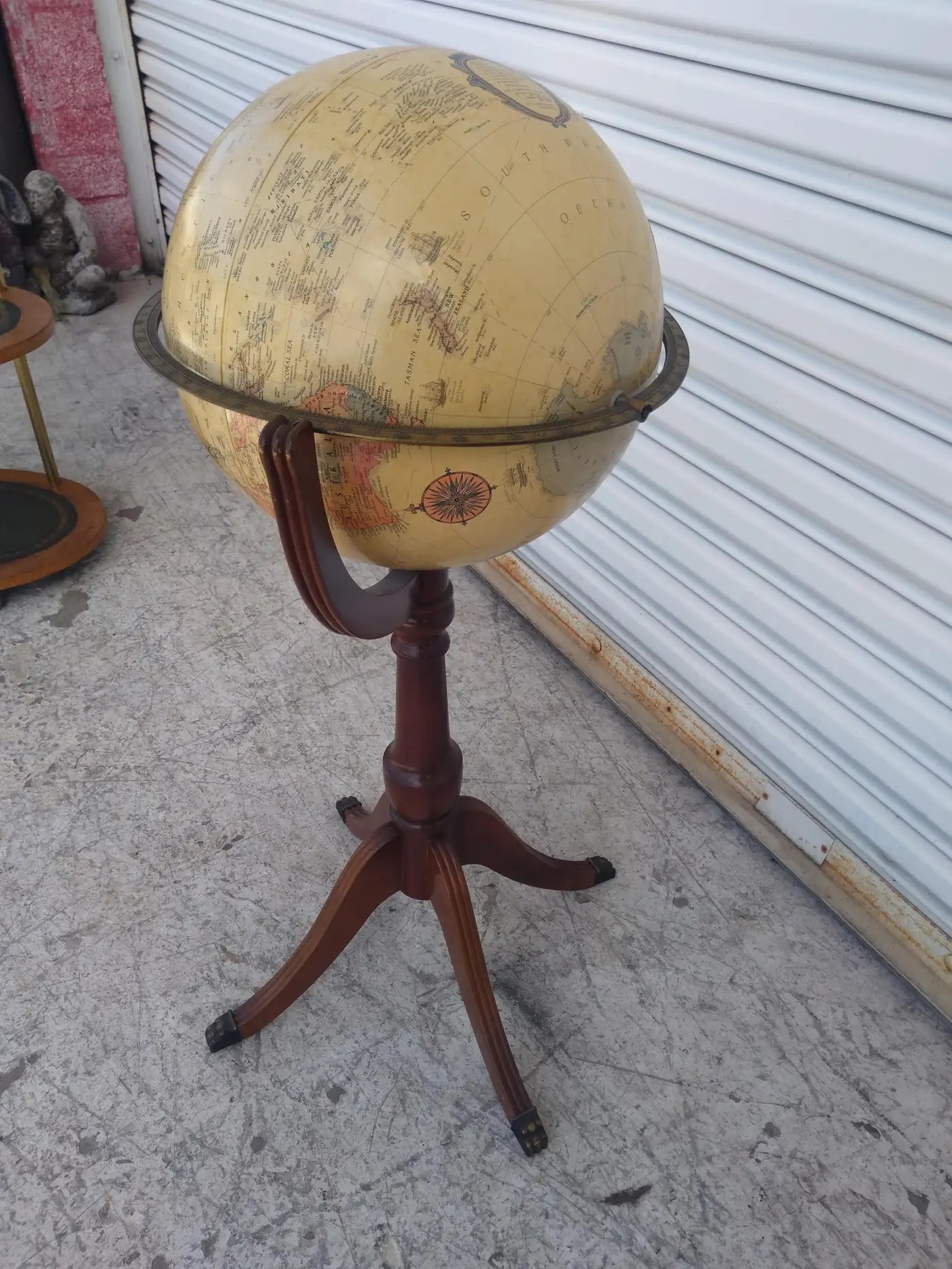 Classic vintage globe on regency pedestal with detailed design