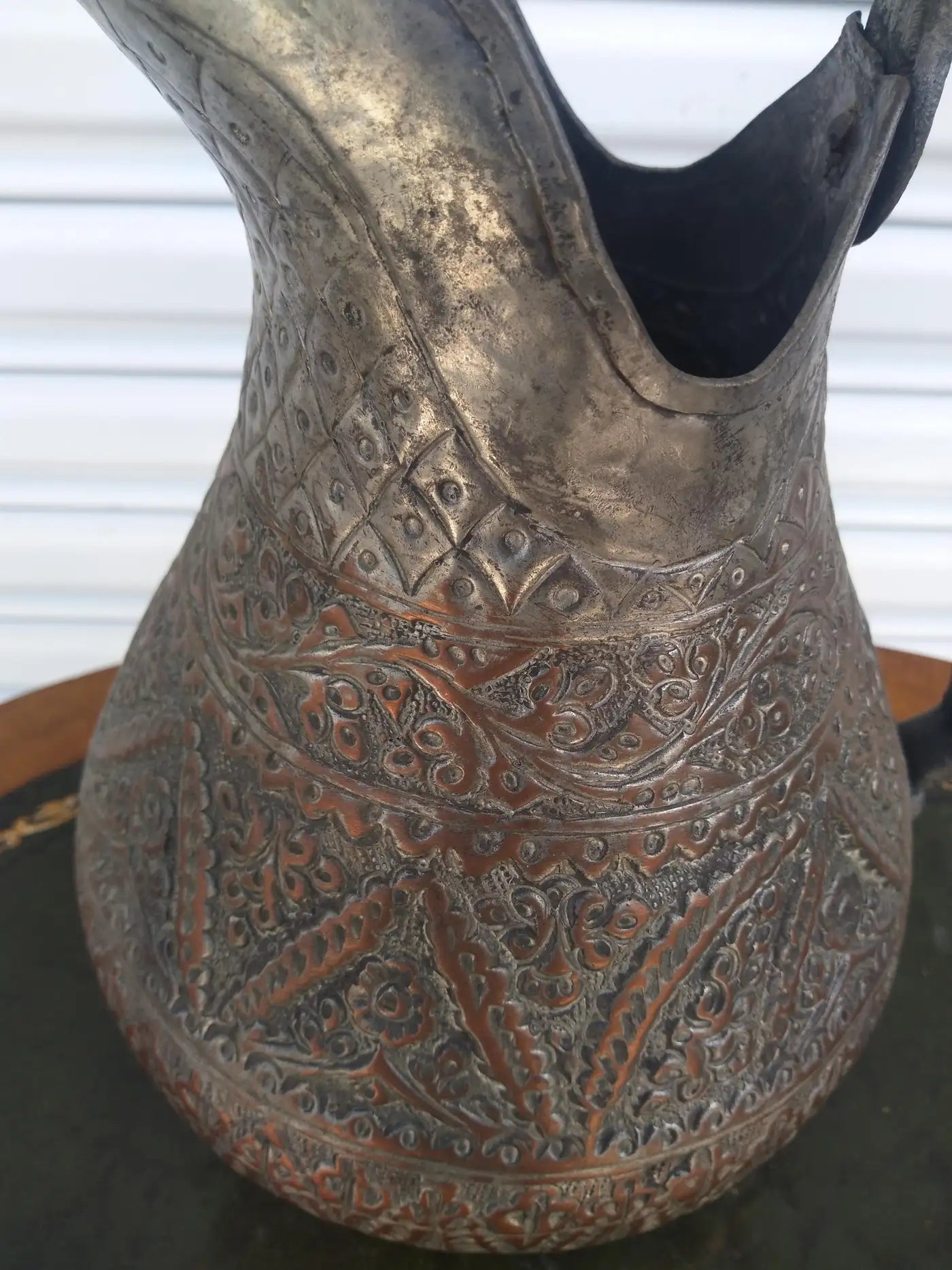 Decorative Middle Eastern pitcher with etched copper finish