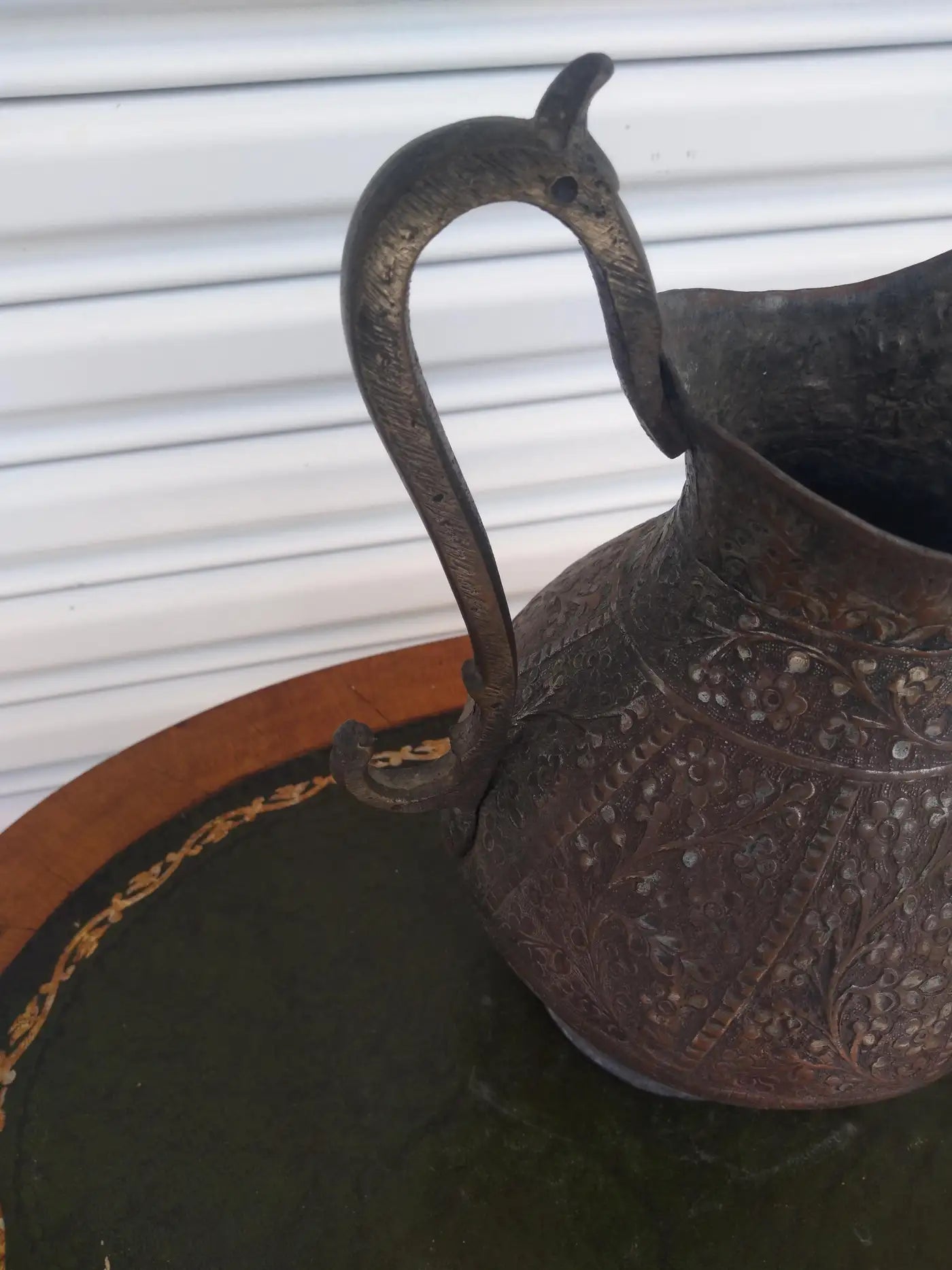 Decorative Middle Eastern metal pitcher with fine details