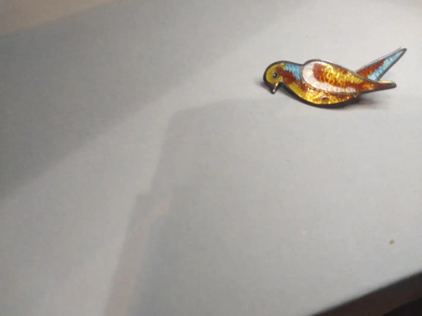 Sterling silver and enameled parrot pin