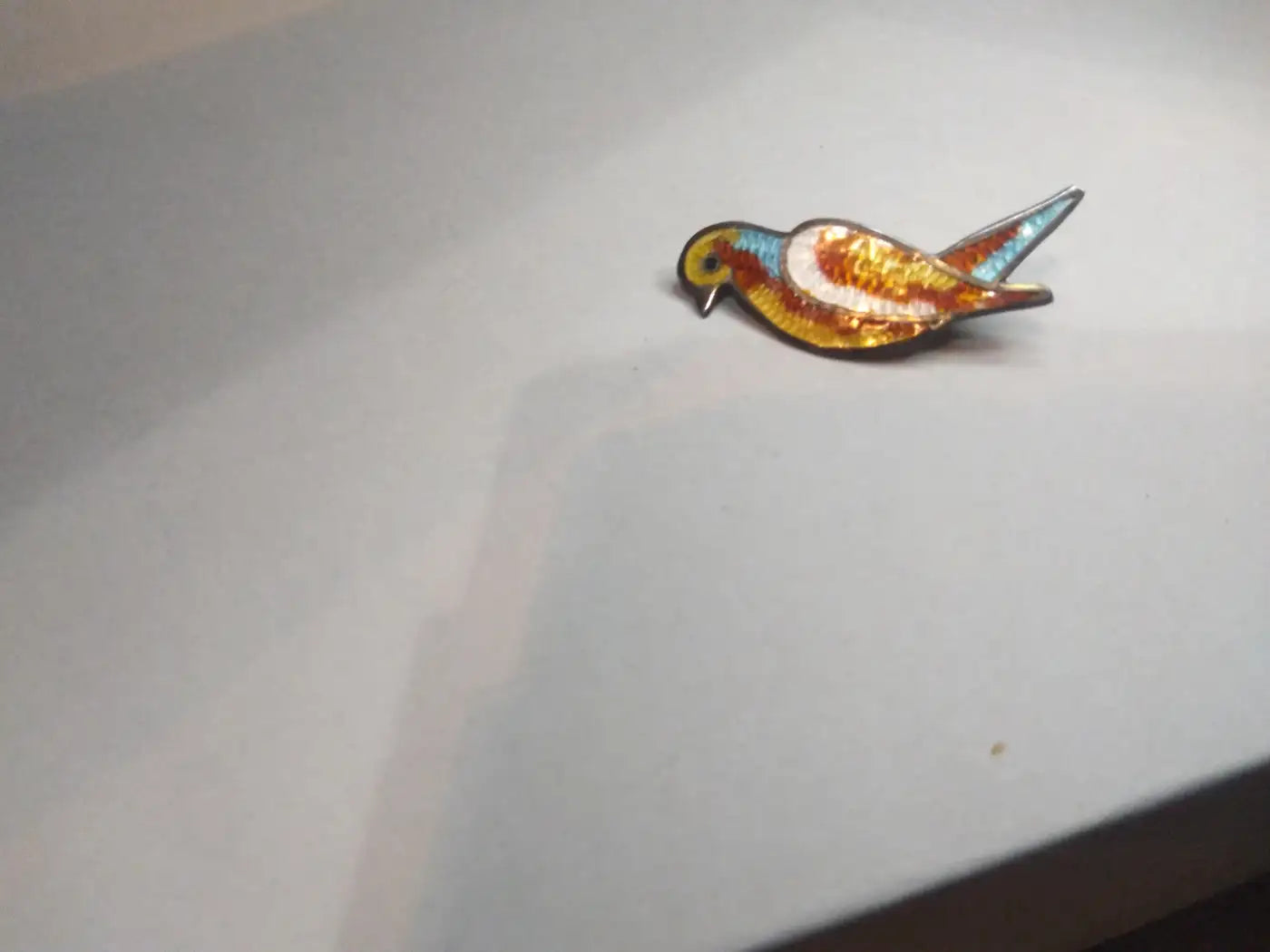 Colorful bird brooch by Jose Frederico