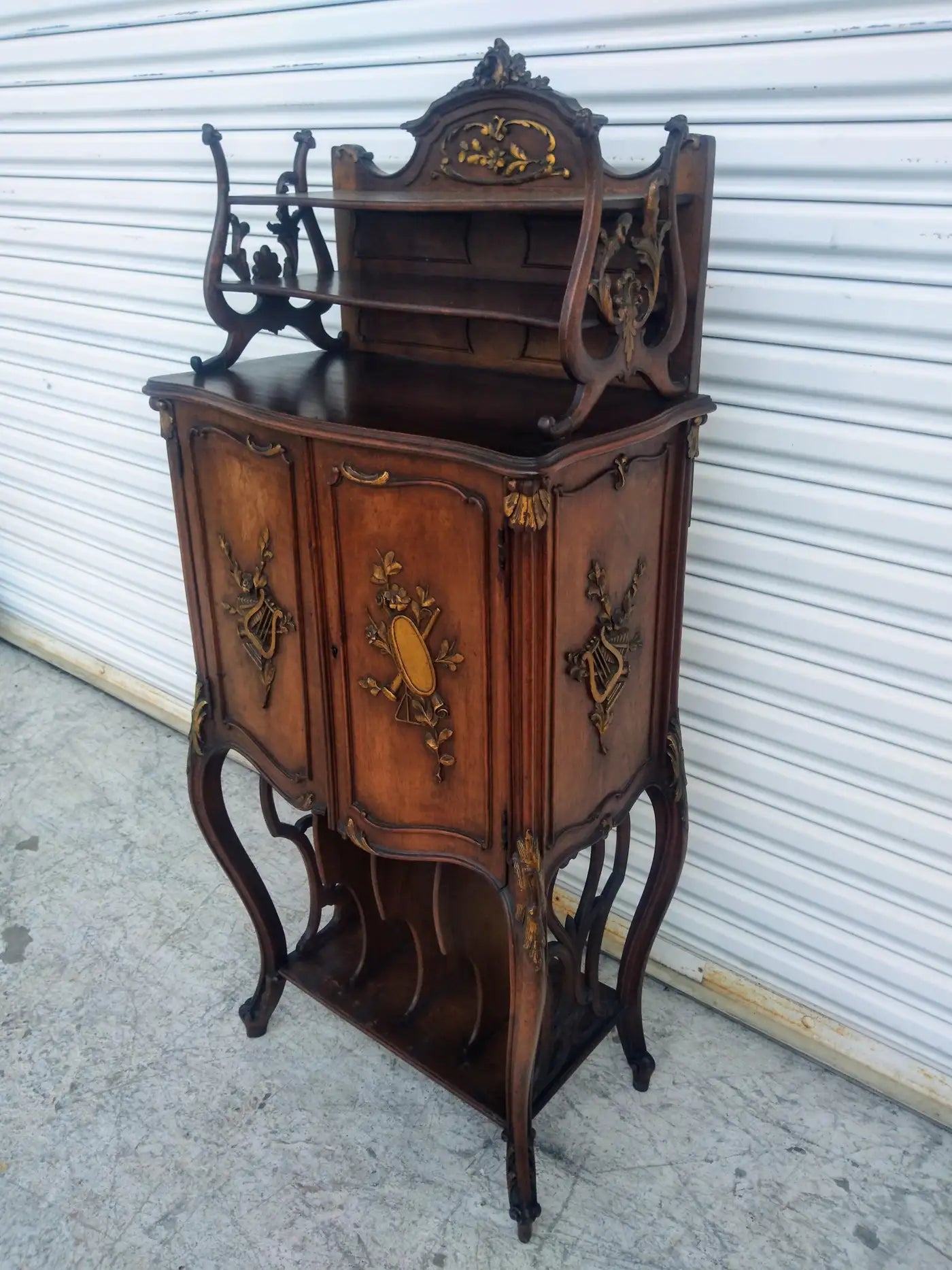 Ornate French music cabinet in rich walnut wood