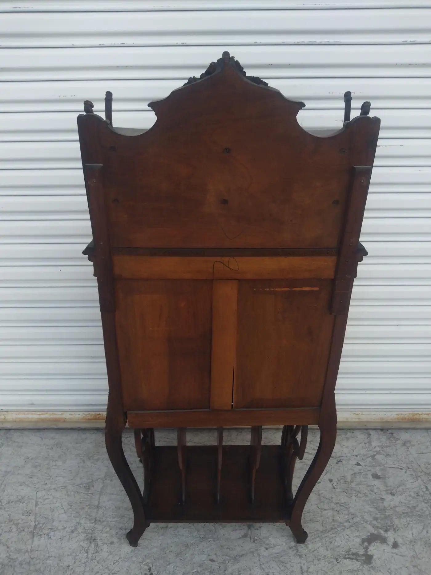 French walnut music cabinet with carved floral accents