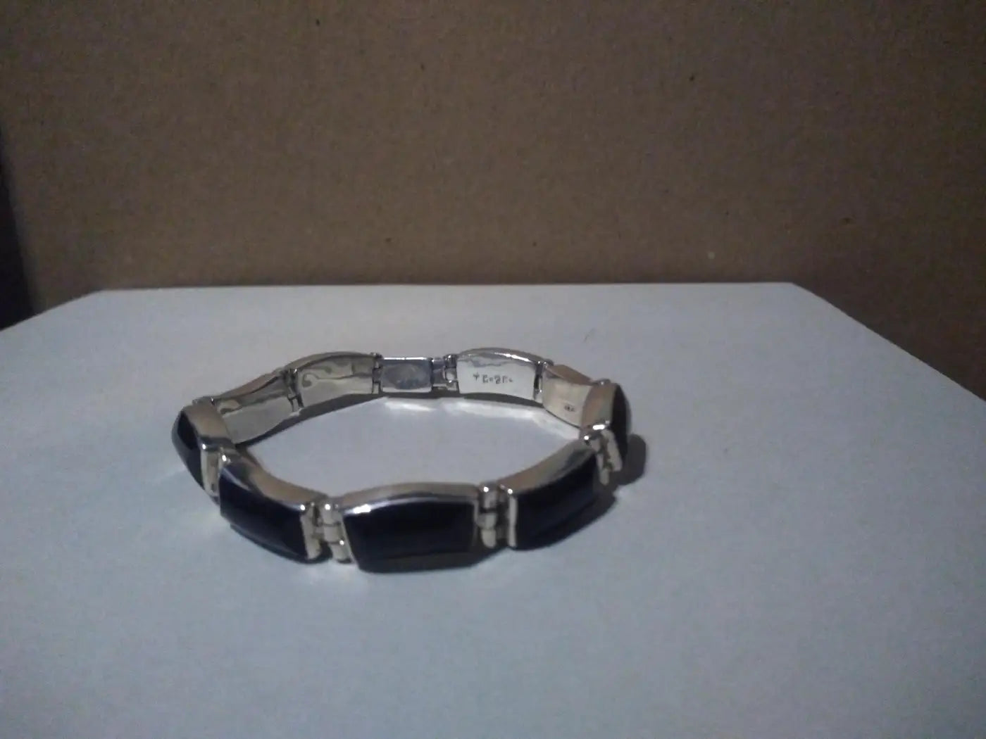 Close-up of .950 silver bracelet with onyx stone