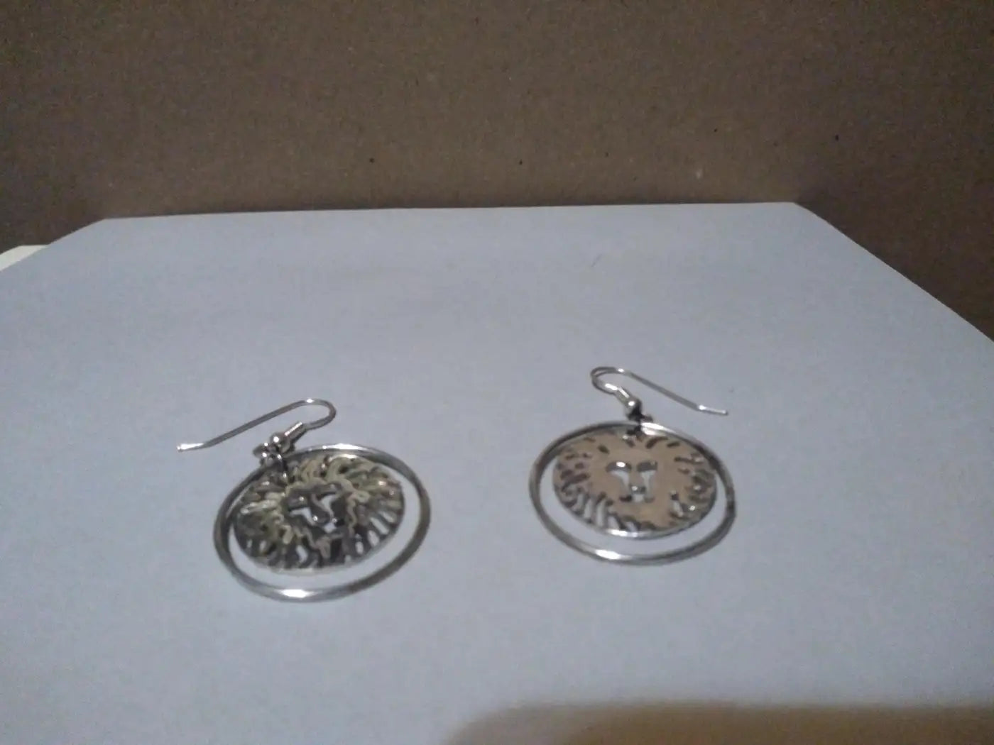 Pair of Sterling Silver Swinging Lion Face Hoop Earrings