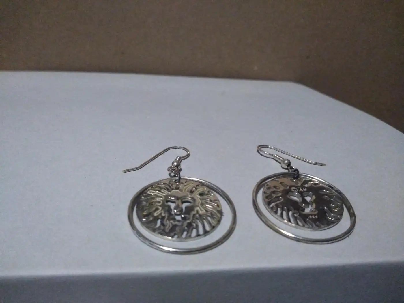 Pair of Sterling Silver Swinging Lion Face Hoop Earrings