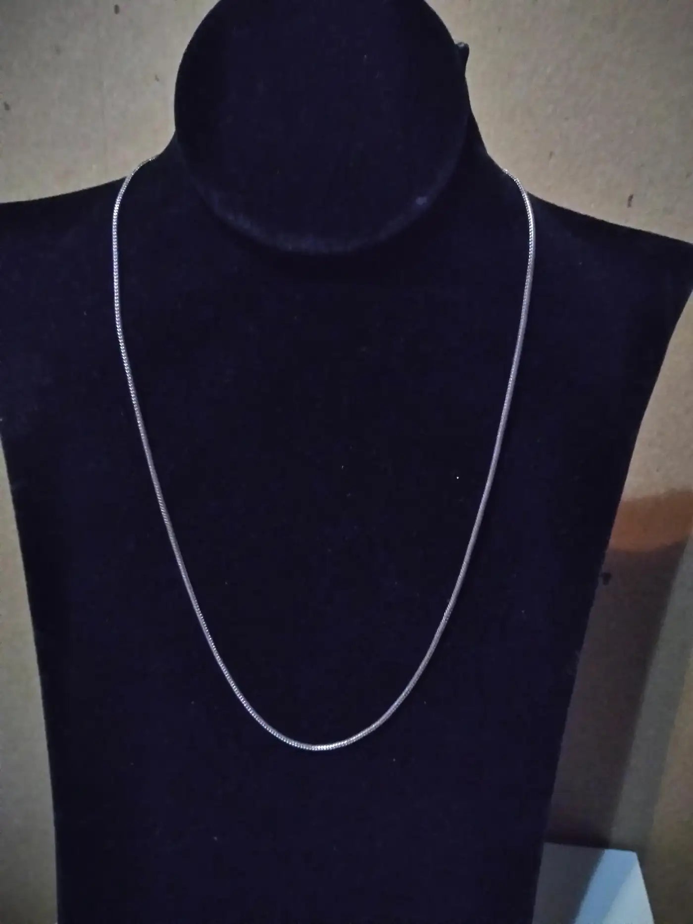 Close-up of flat serpentine silver chain