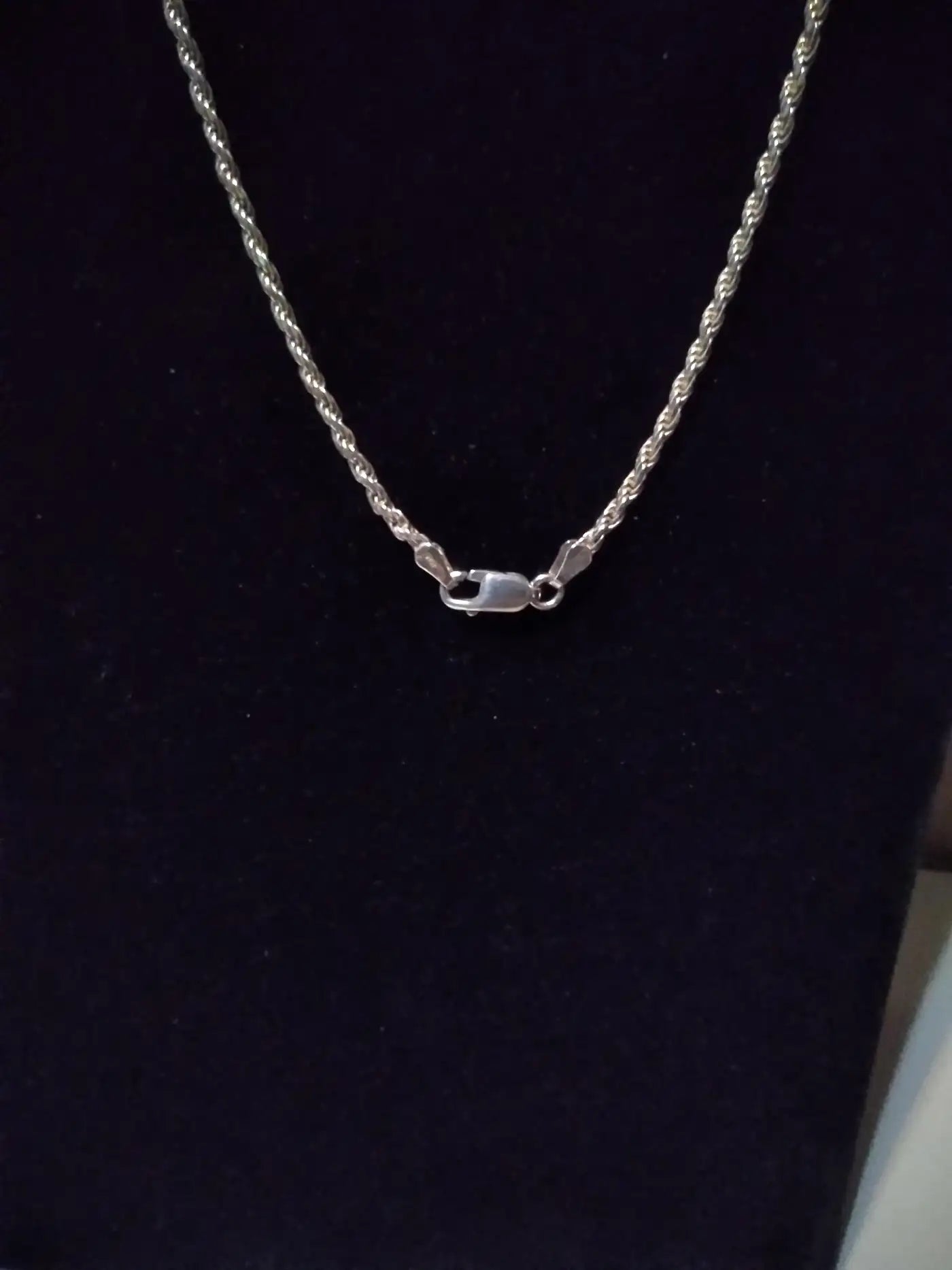 Unisex 18" silver rope necklace on display