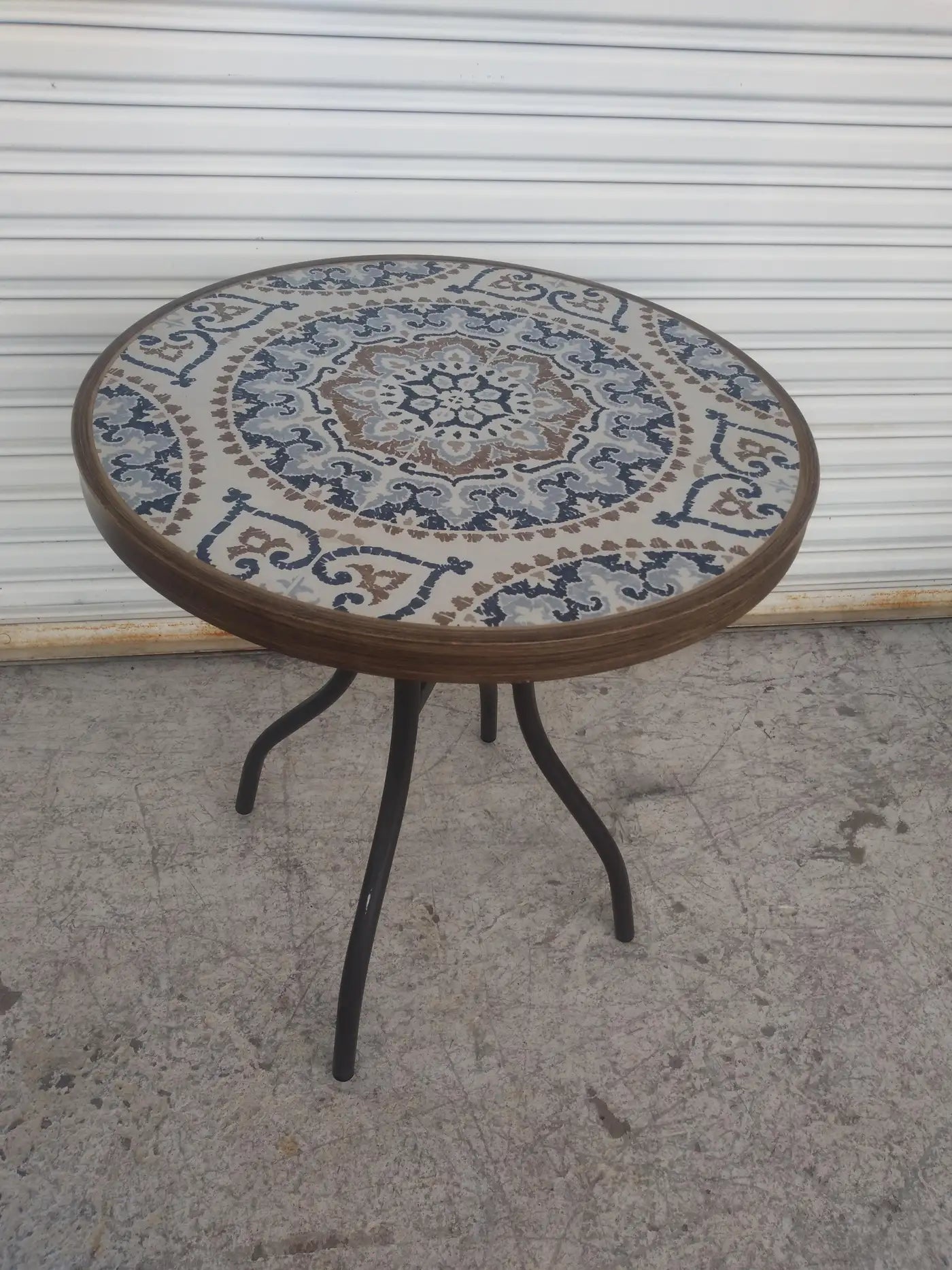 Round tile top patio table with pedestal base