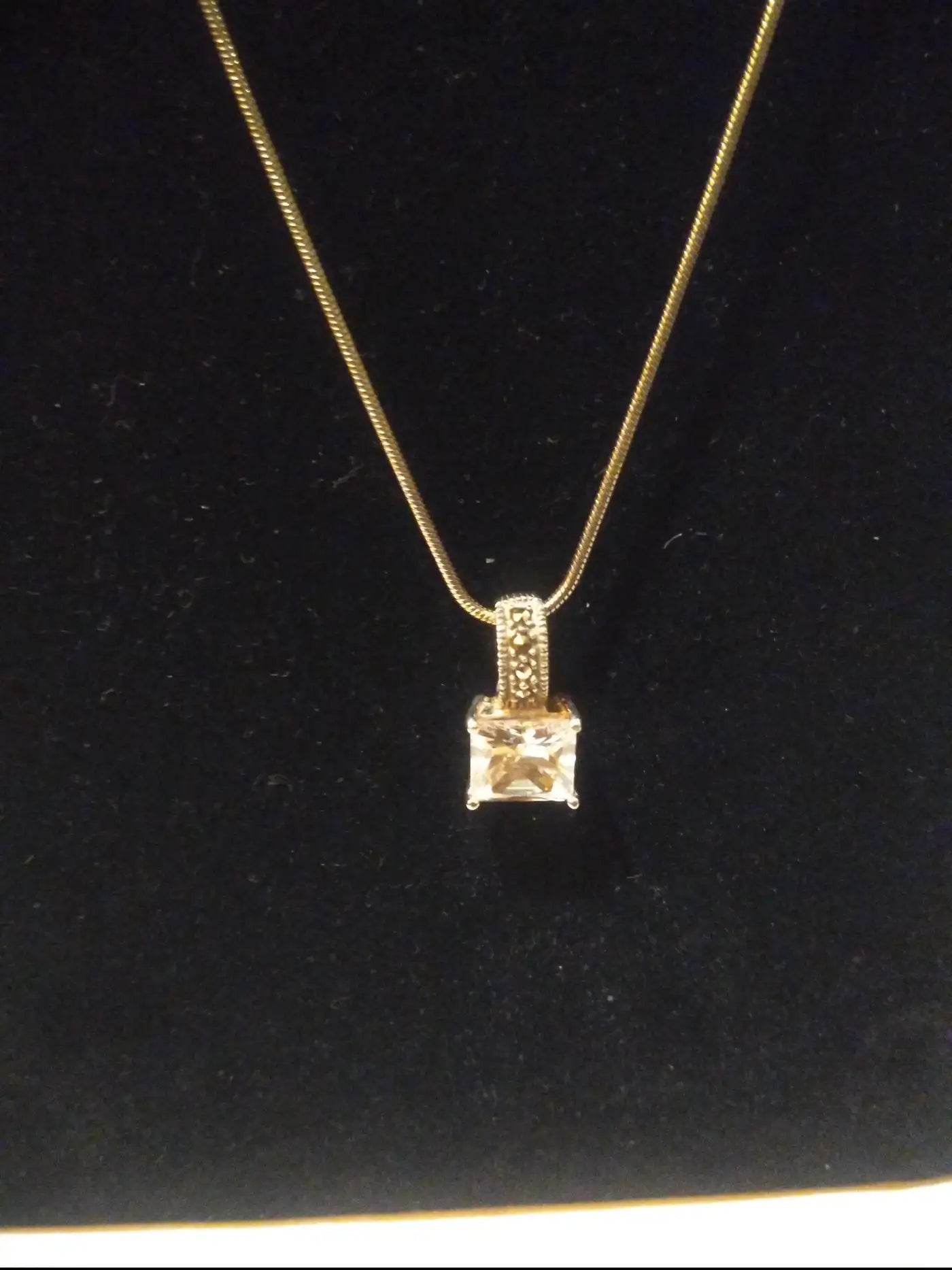 Close-up of 7 carat CZ pendant on silver necklace