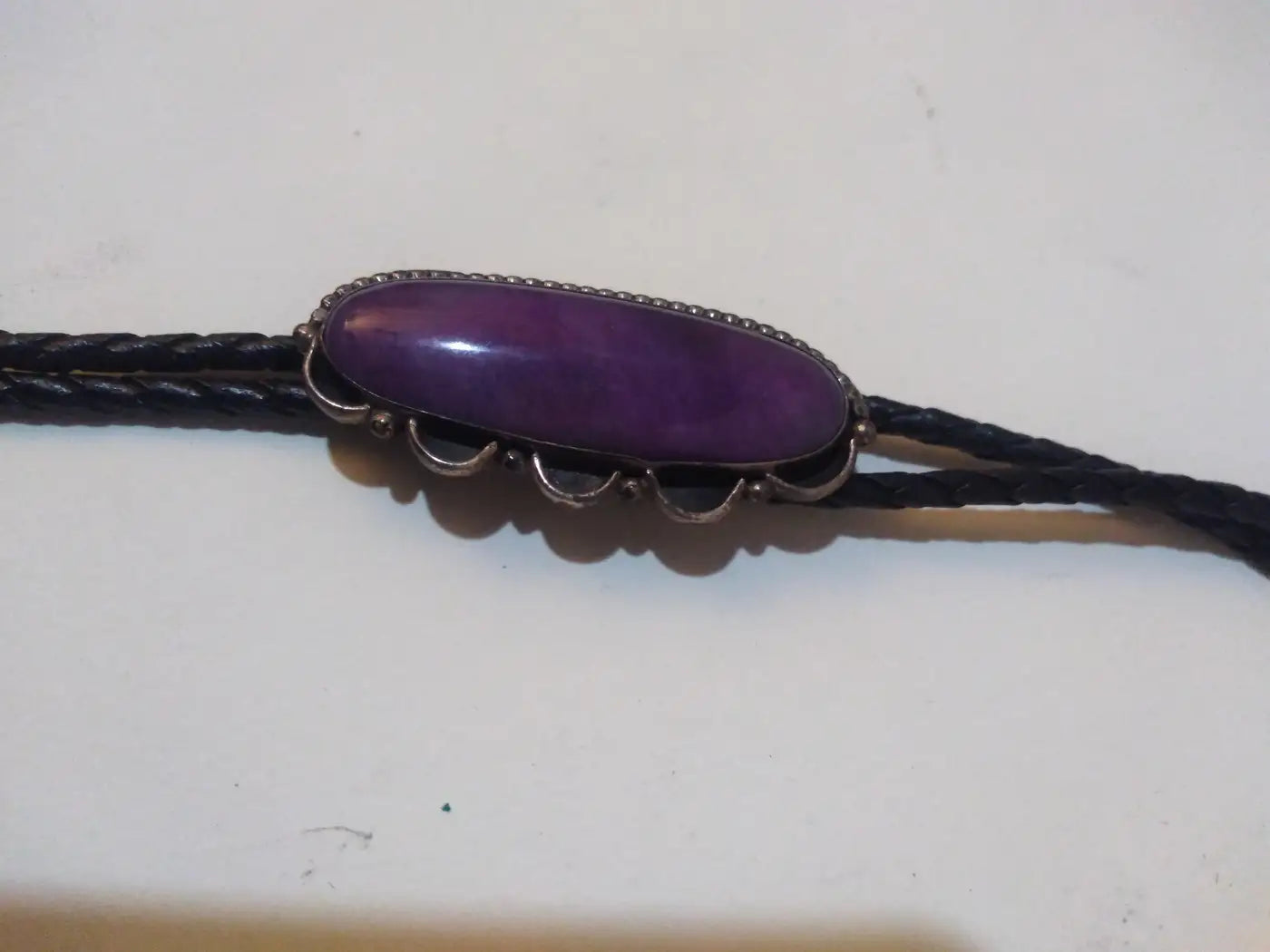 Elegant charoite bolo tie with sterling silver tips