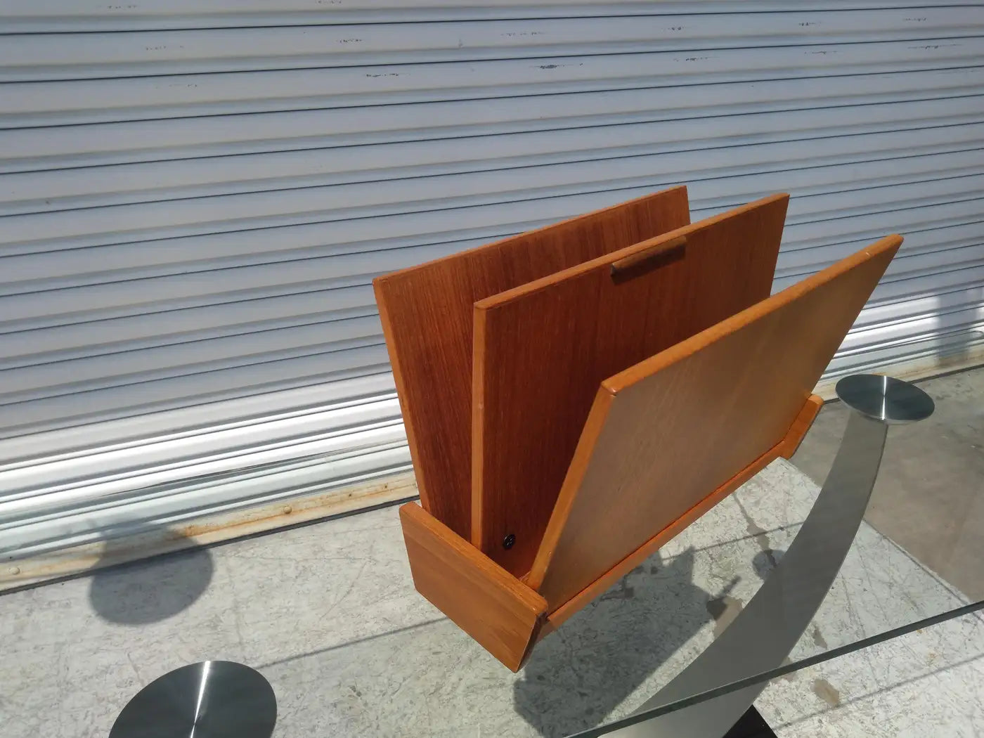 Mid-century teak magazine holder with sleek design
