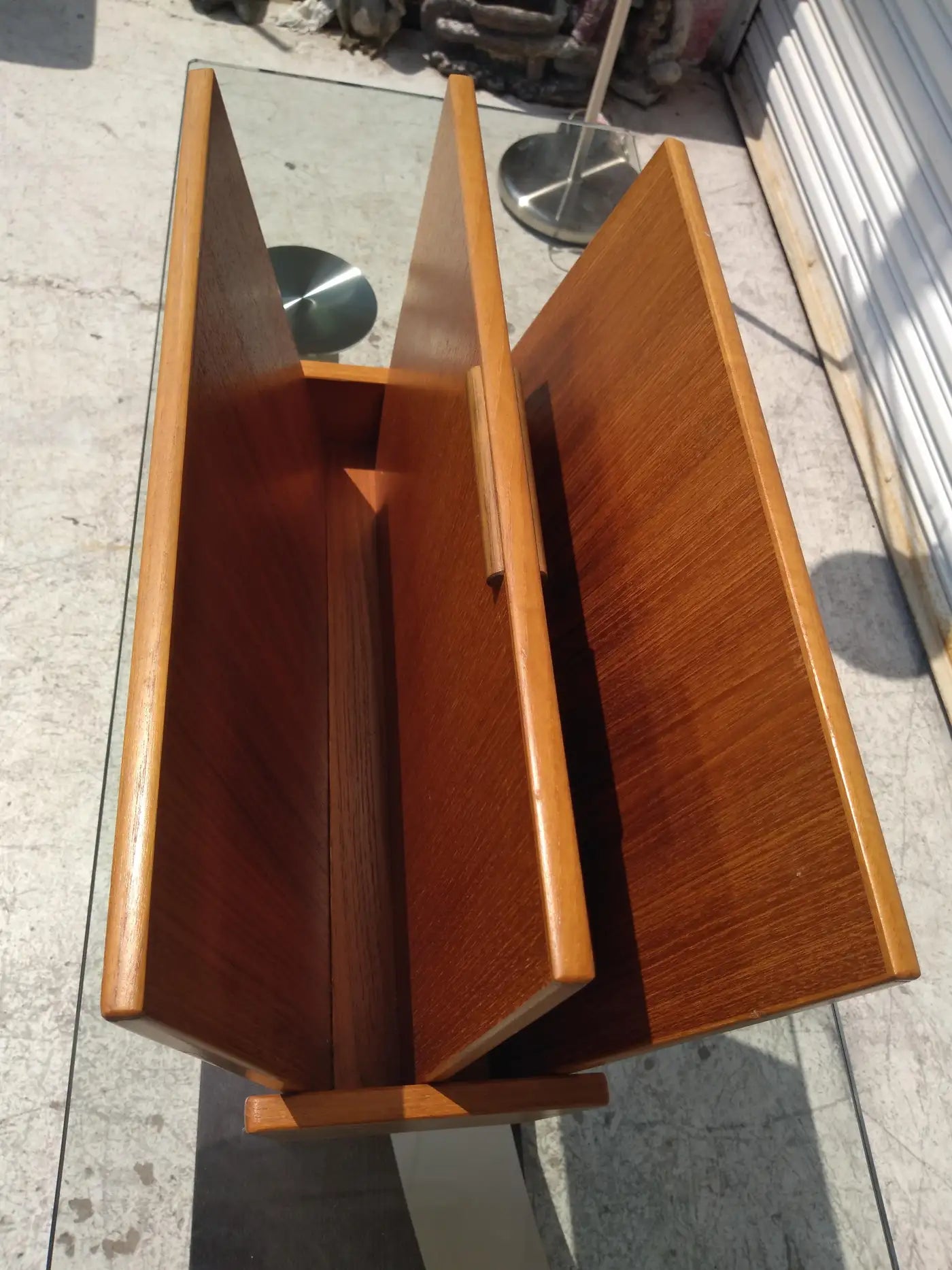 Stylish teak magazine rack in mid-century design