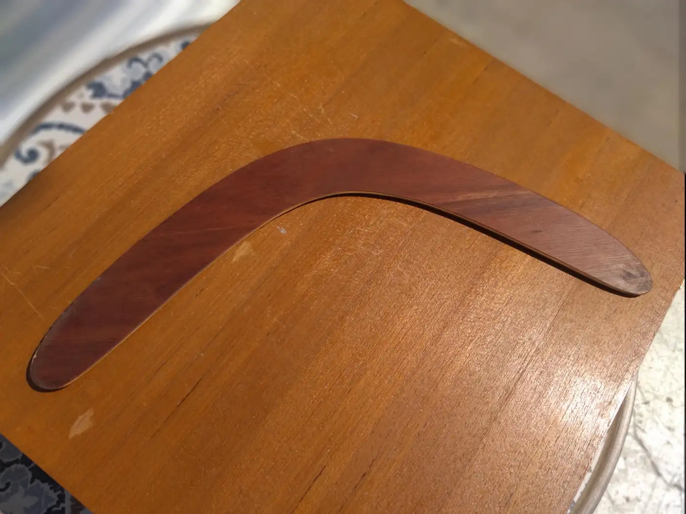 Side view of vintage Niyaan Aboriginal boomerang