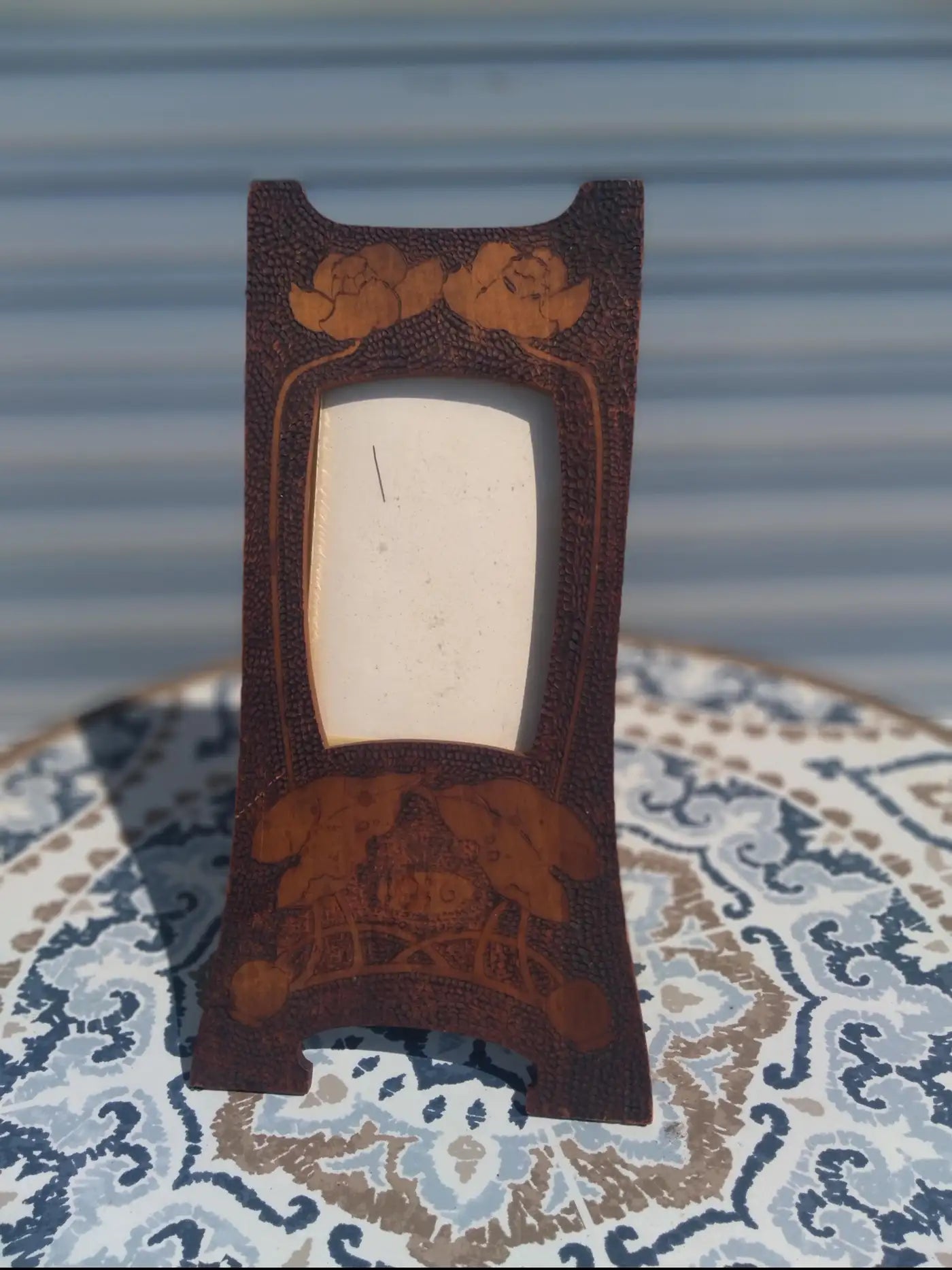 Elegant carved wooden photo frame for display