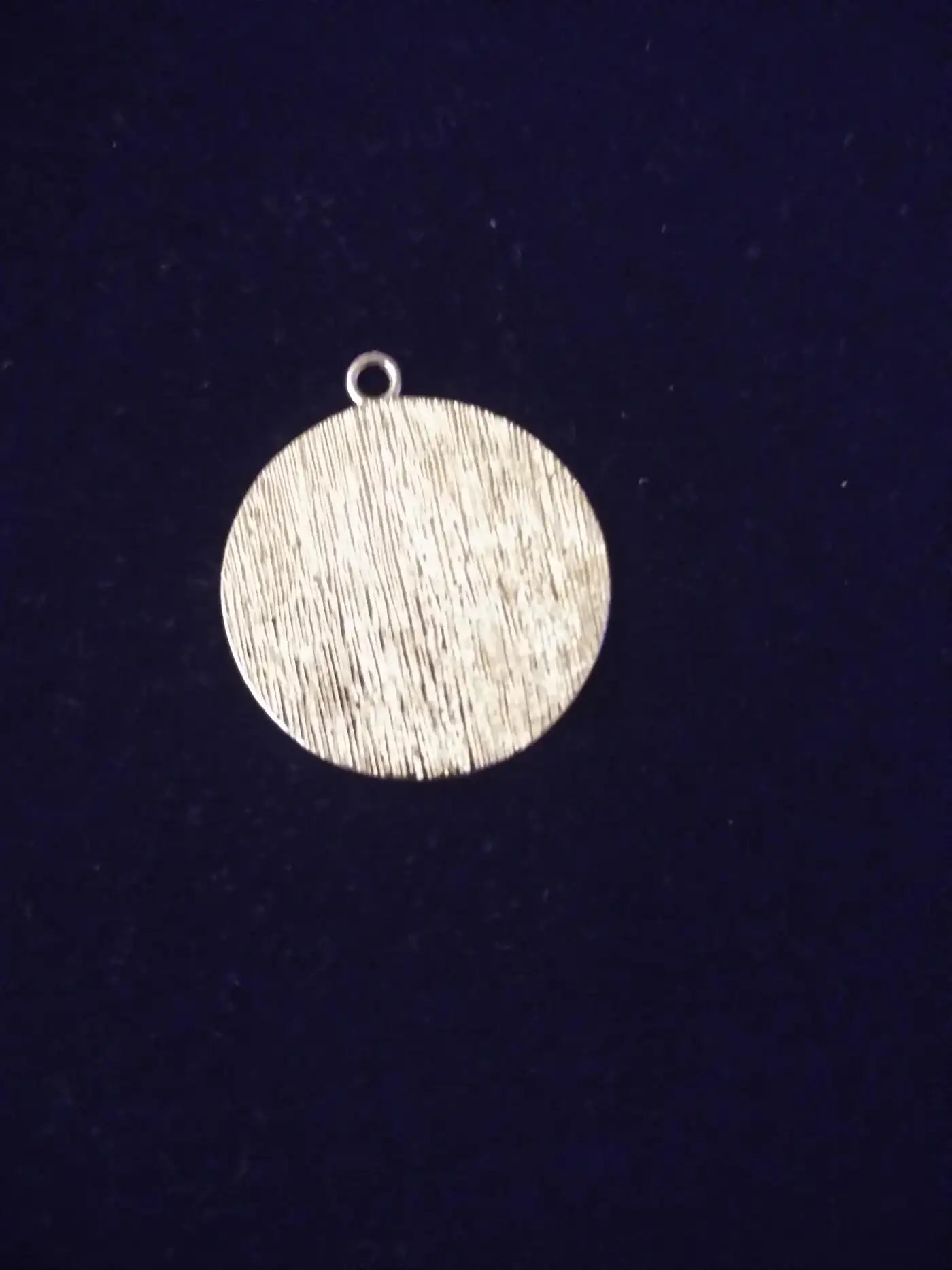 Silver sundial jewelry with symbolic design