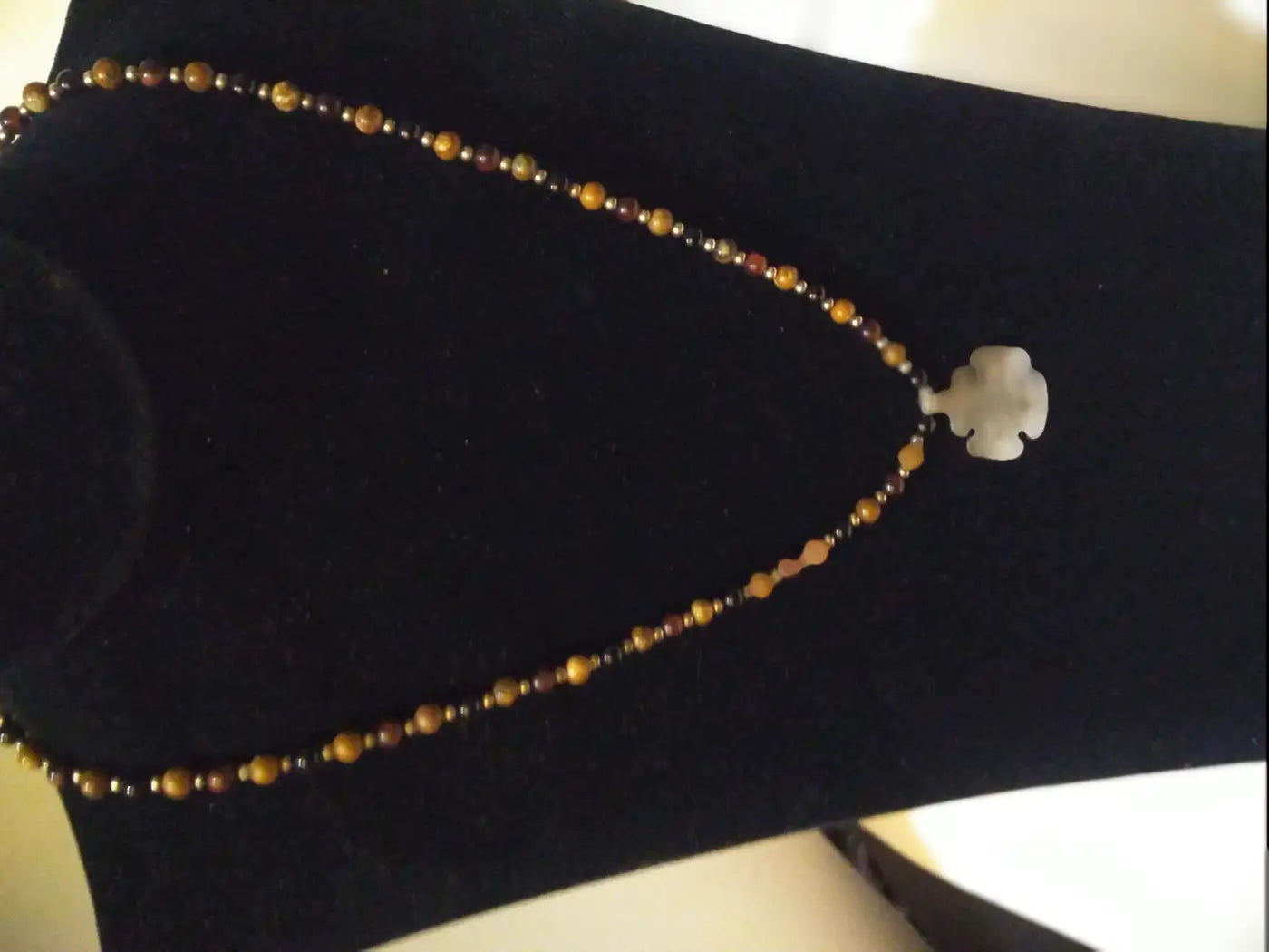 Sterling silver pendant necklace with beaded design