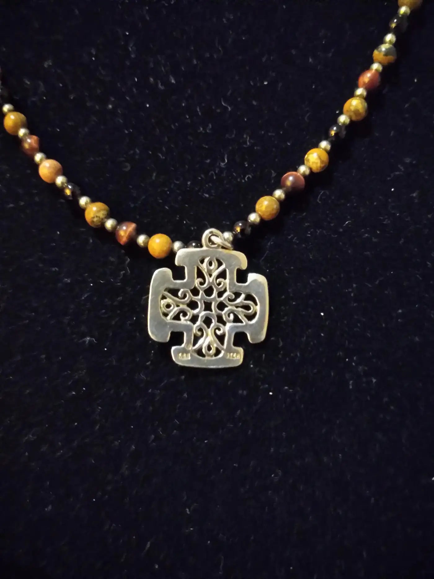 Close-up of elegant beaded sterling silver pendant necklace