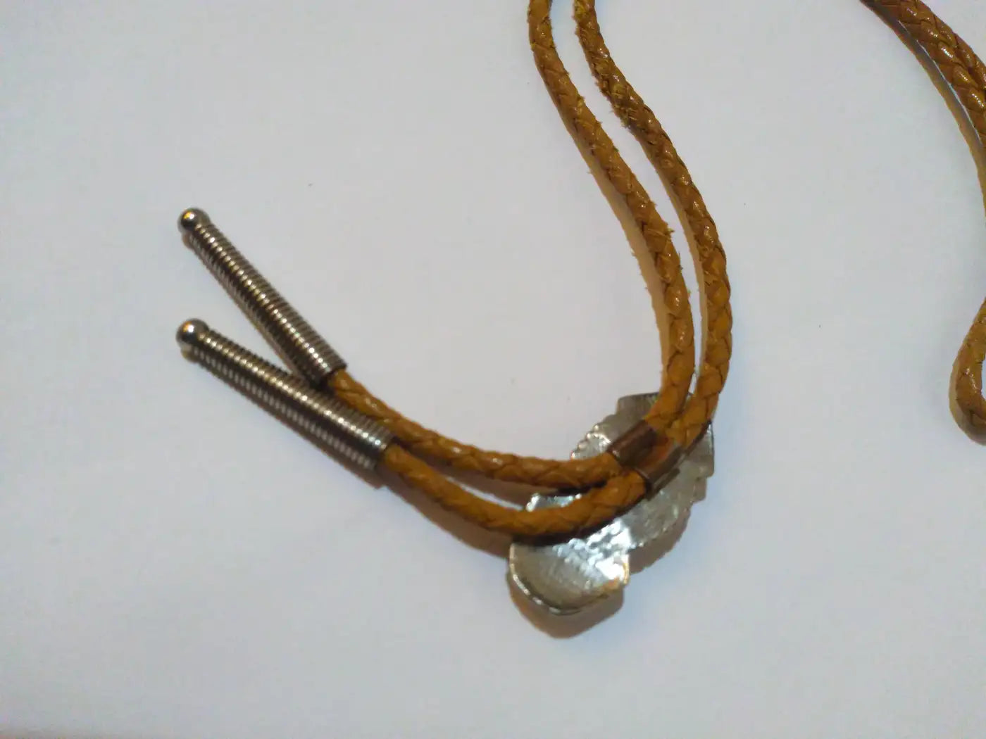 Elegant sterling silver bolo tie with turquoise accent
